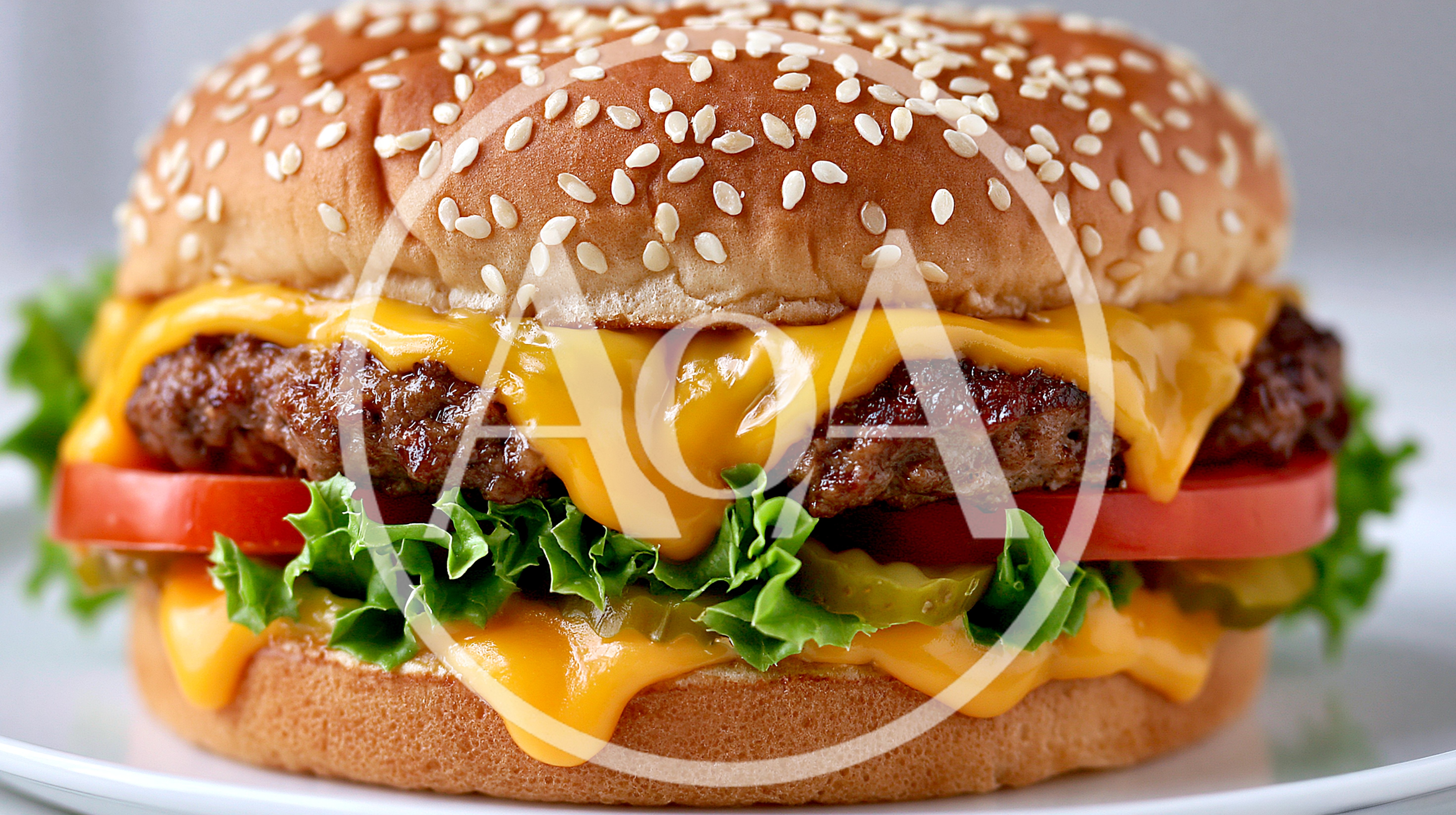 Close Up Of A Delicious Cheeseburger On A Plate