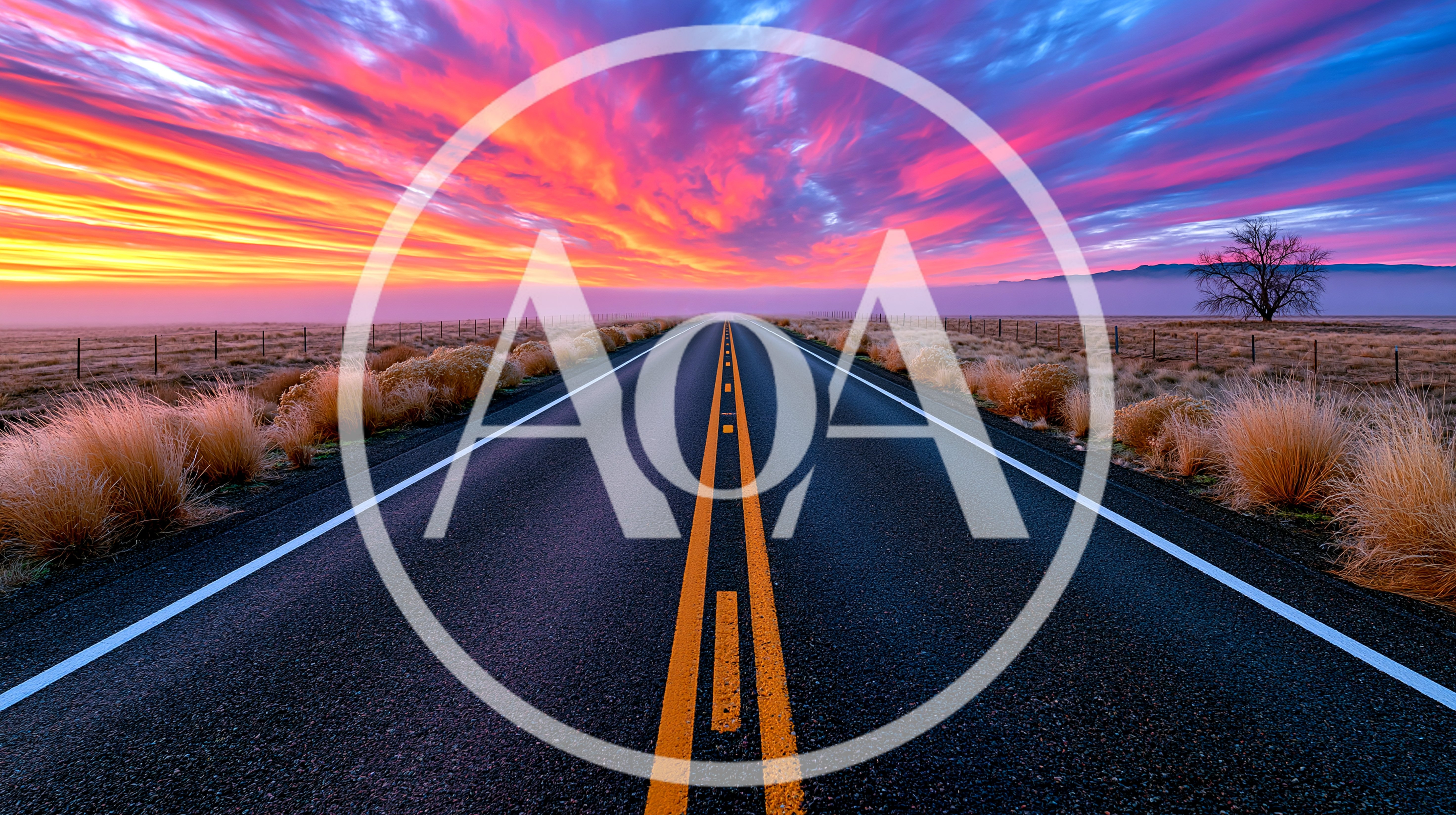 Empty Asphalt Road Leading Toward A Vibrant Sunset