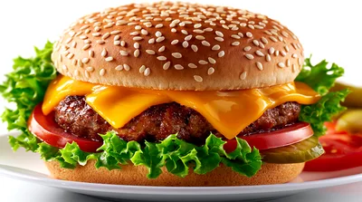 Classic Cheeseburger With Lettuce And Tomato On Plate