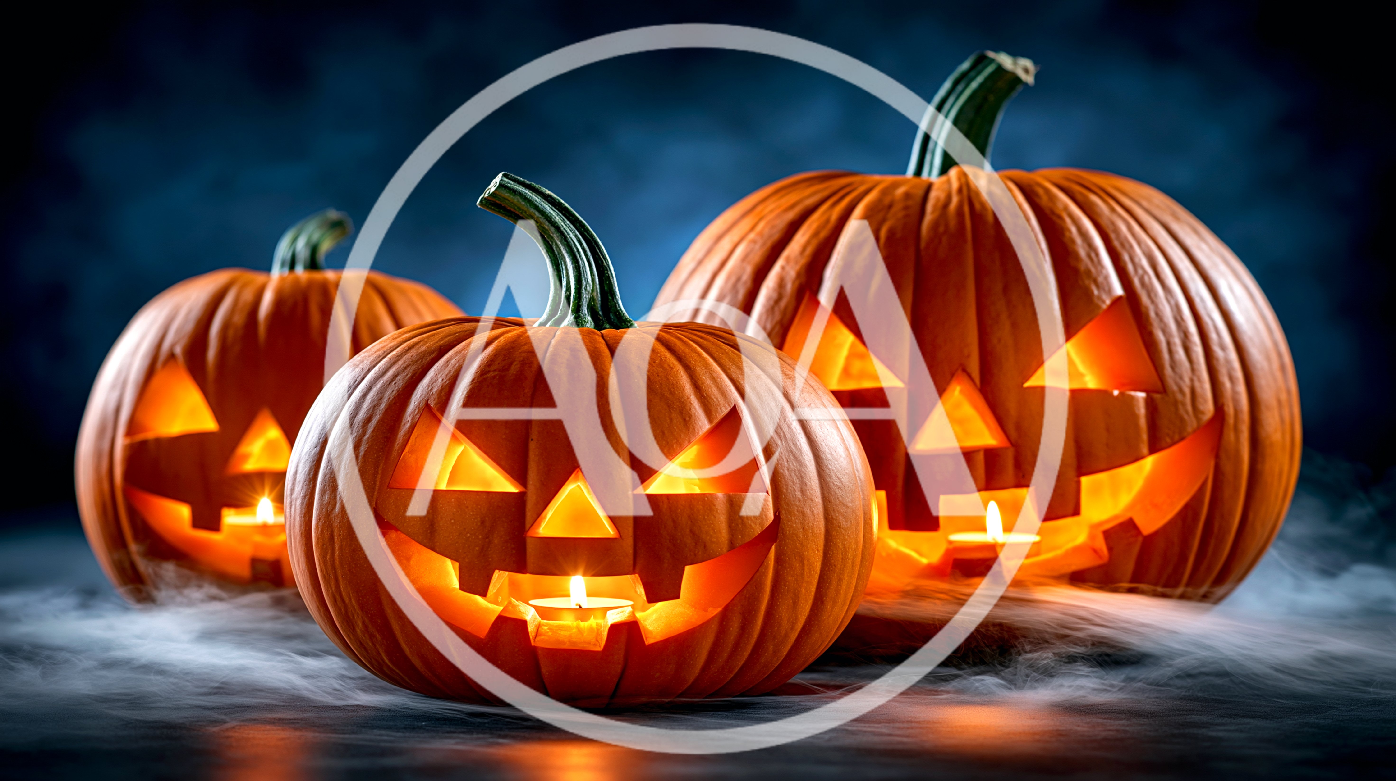 Three Glowing Jack O Lanterns On A Foggy Surface