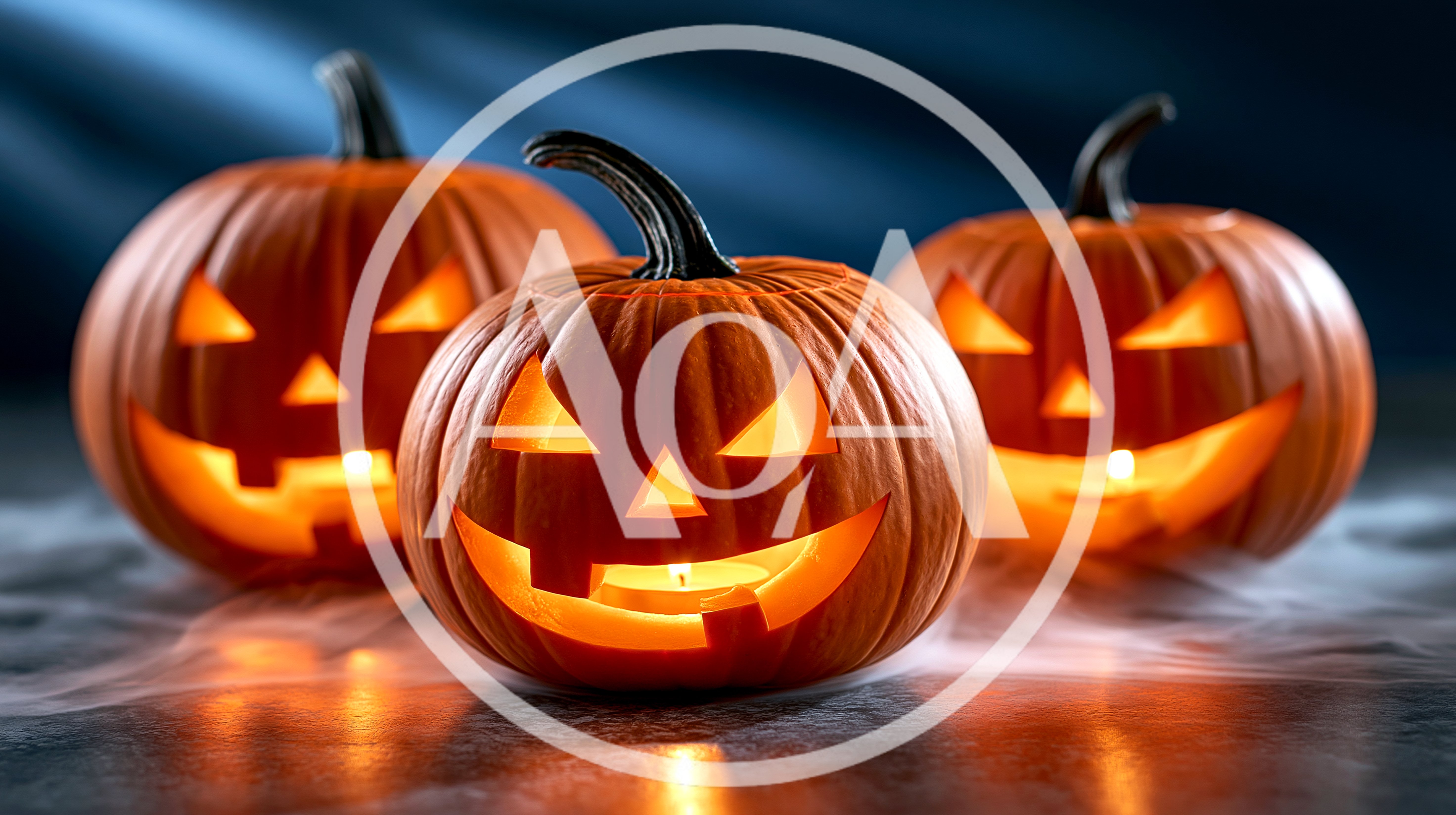 Three Glowing Jack O Lanterns On A Foggy Surface