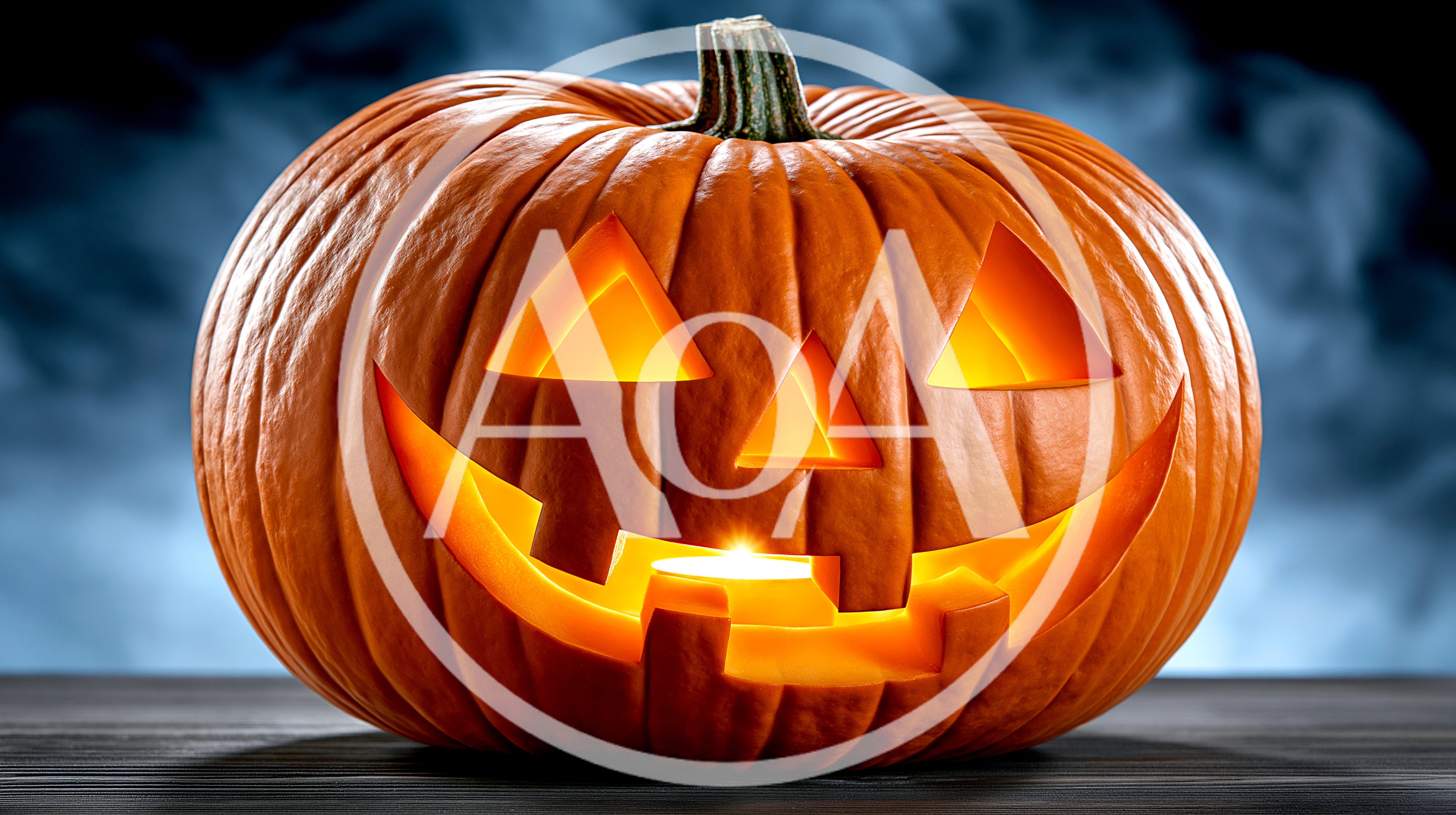 Glowing Jack O Lantern Pumpkin On Dark Surface