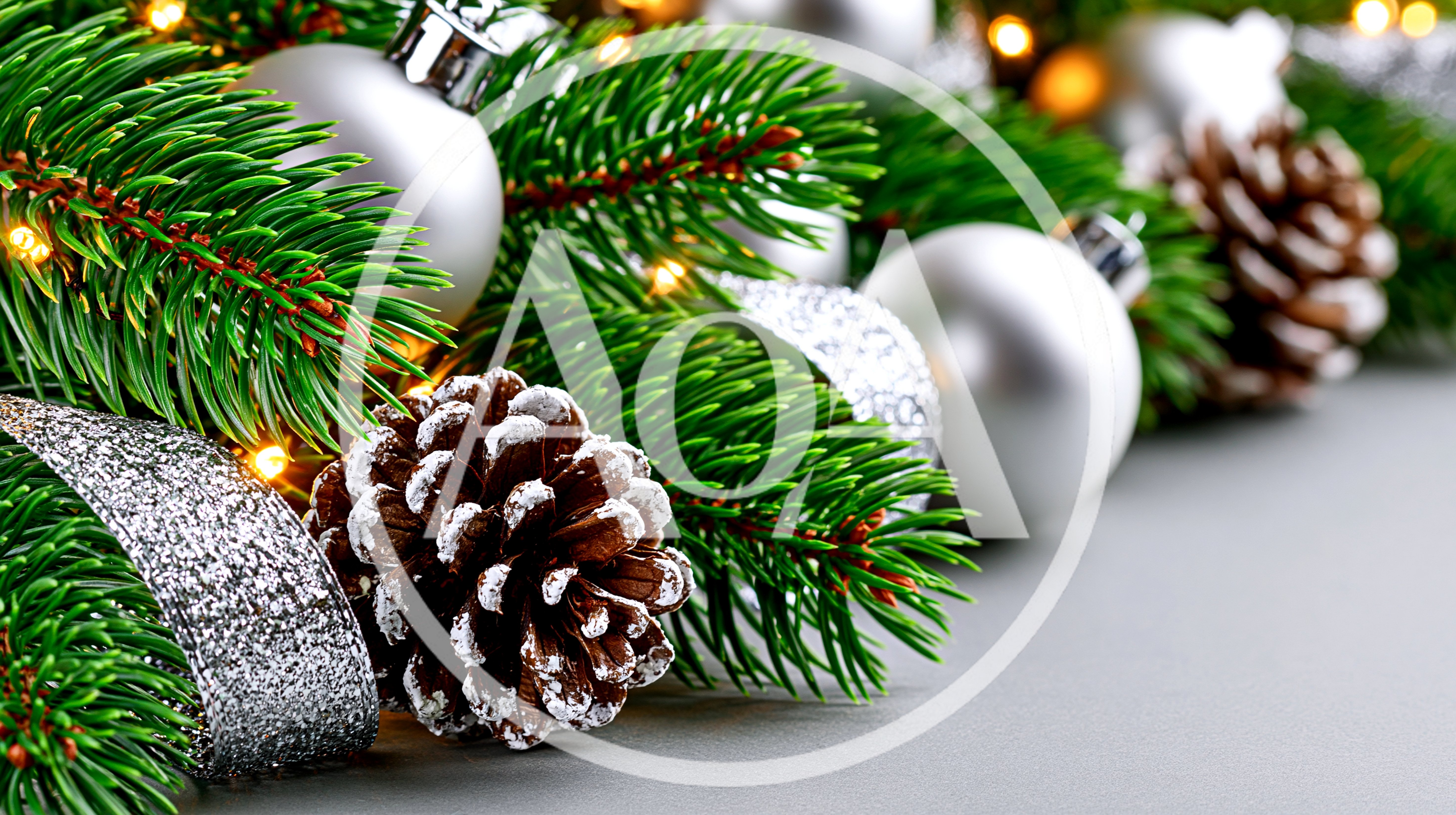 Christmas Pine Branches With Silver Ornaments And Pinecones