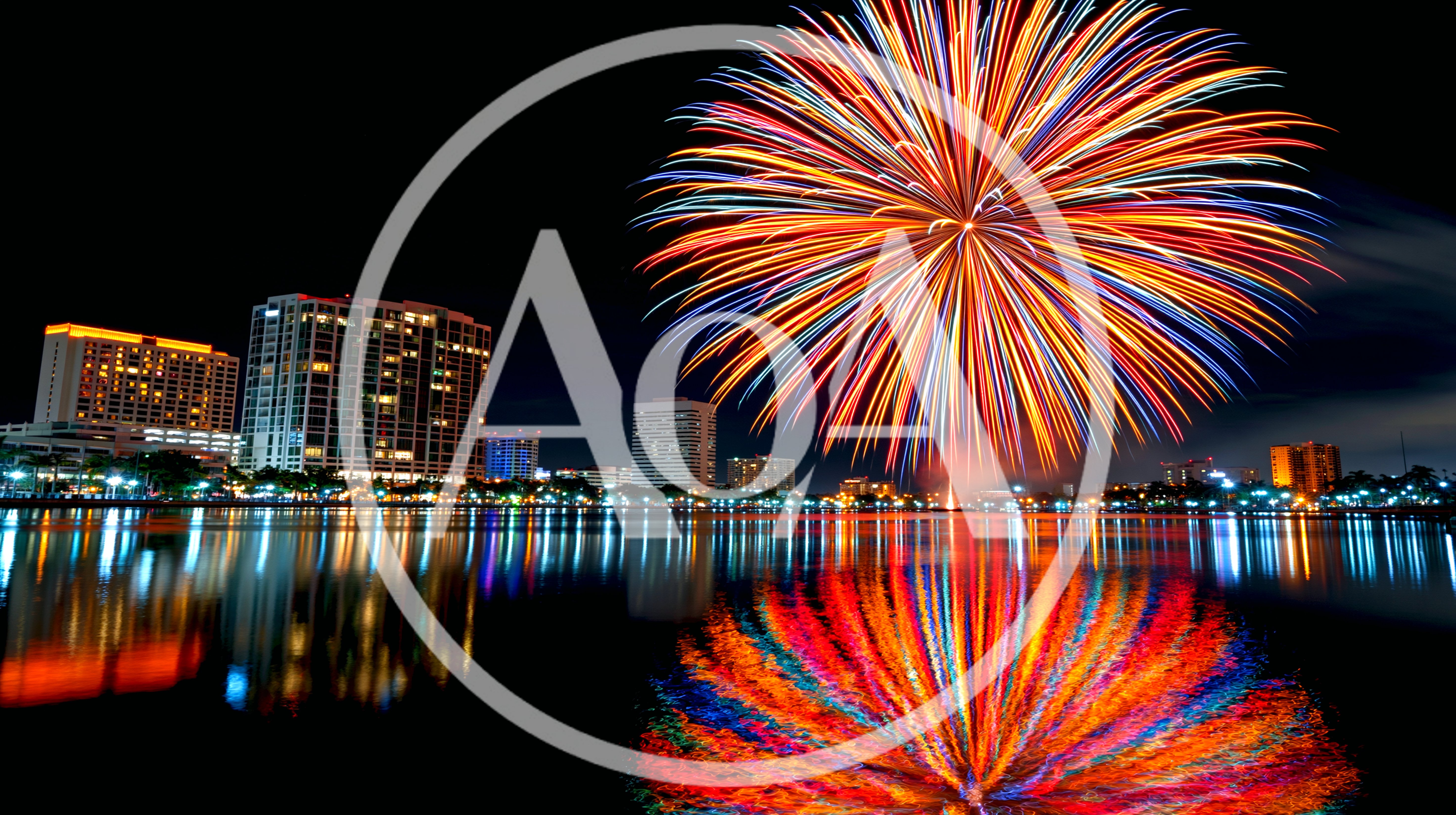 Vibrant Fireworks Display Over City Skyline At Night