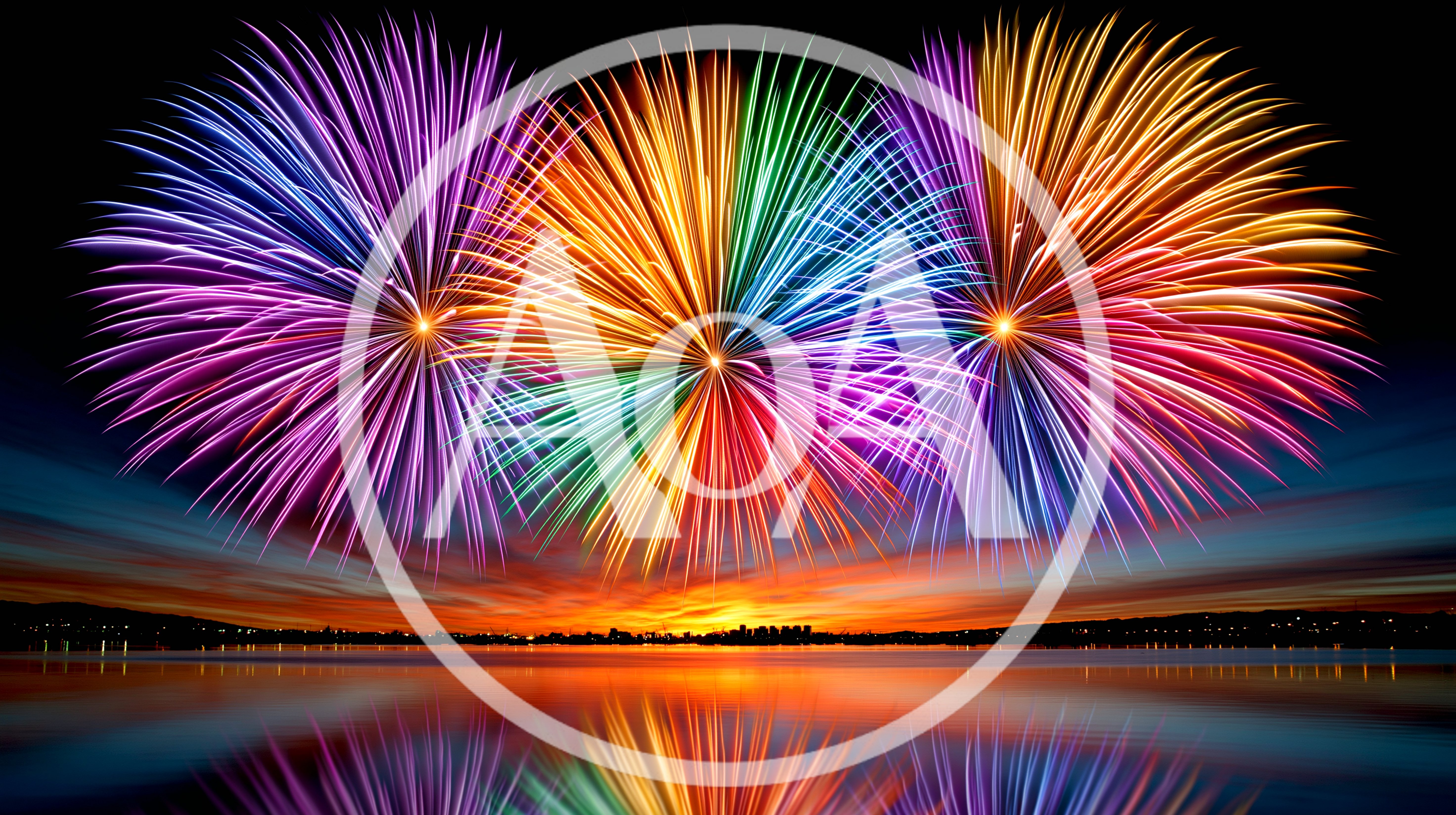 Vibrant Multicolored Fireworks Display Over Calm Lake