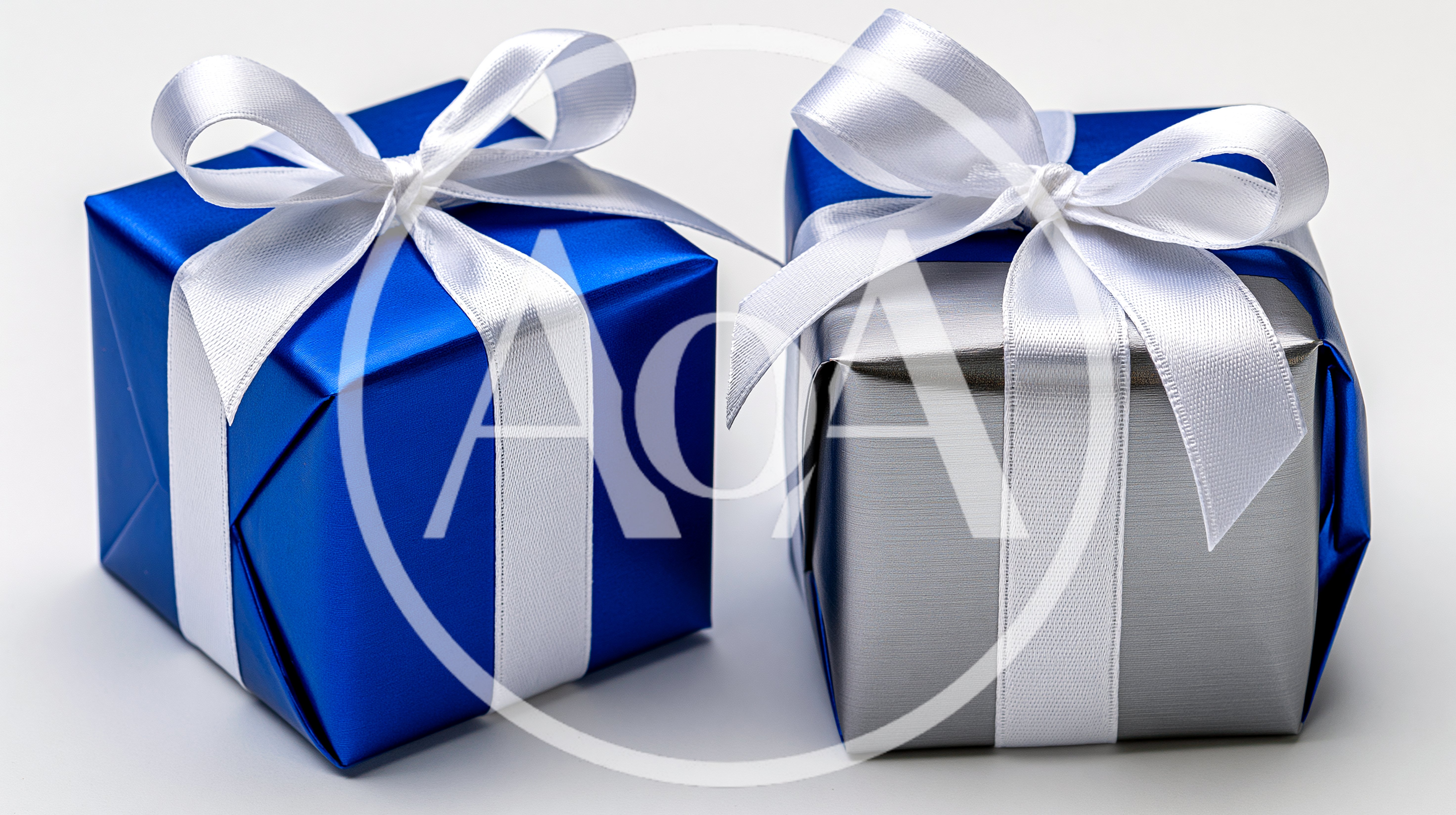 Two Wrapped Gift Boxes With White Ribbons