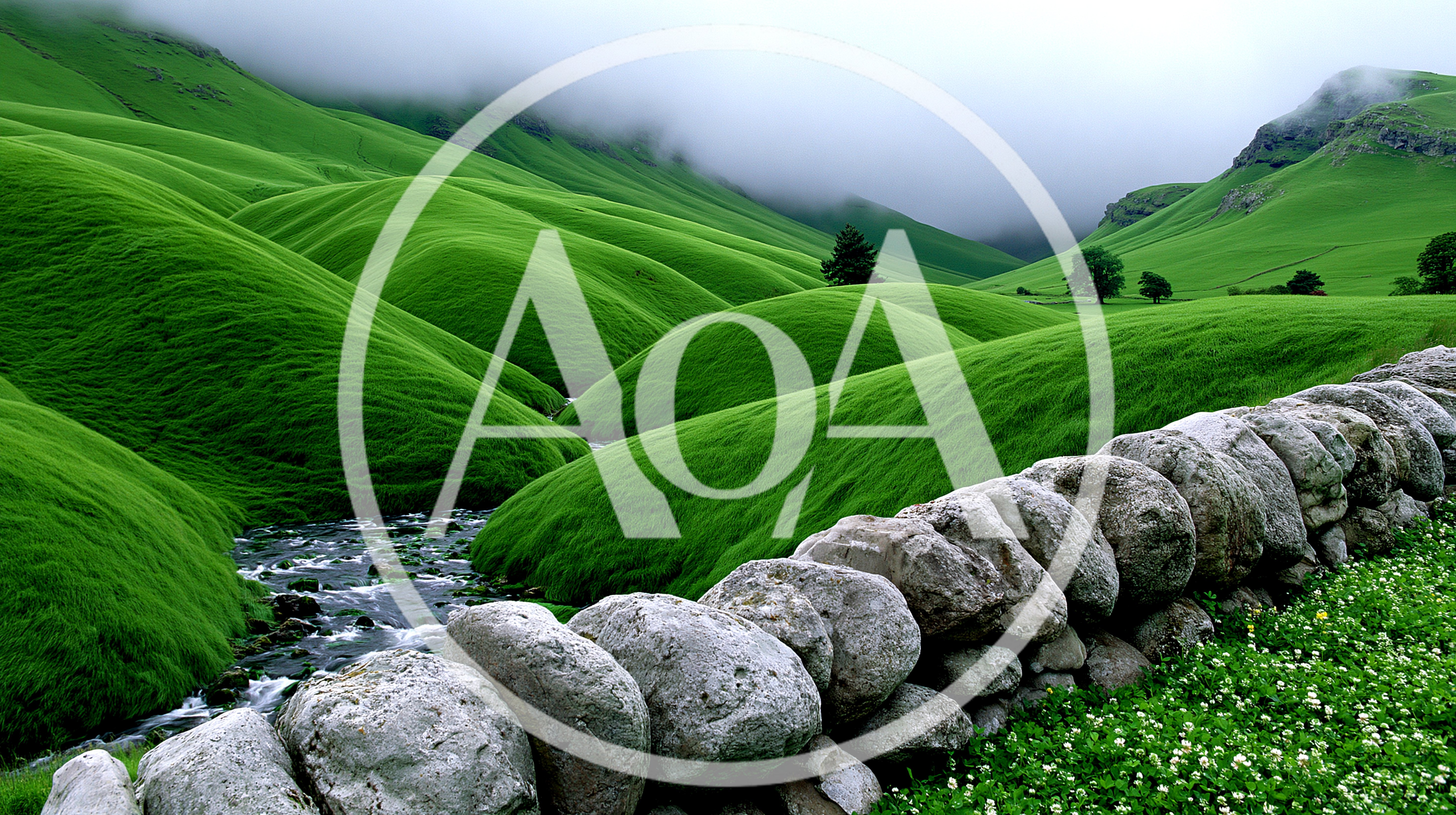 Rolling Green Hills With A Stone Wall And Stream