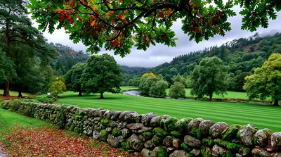 Scenic Landscape With Stone Wall And Lush Green Meadow