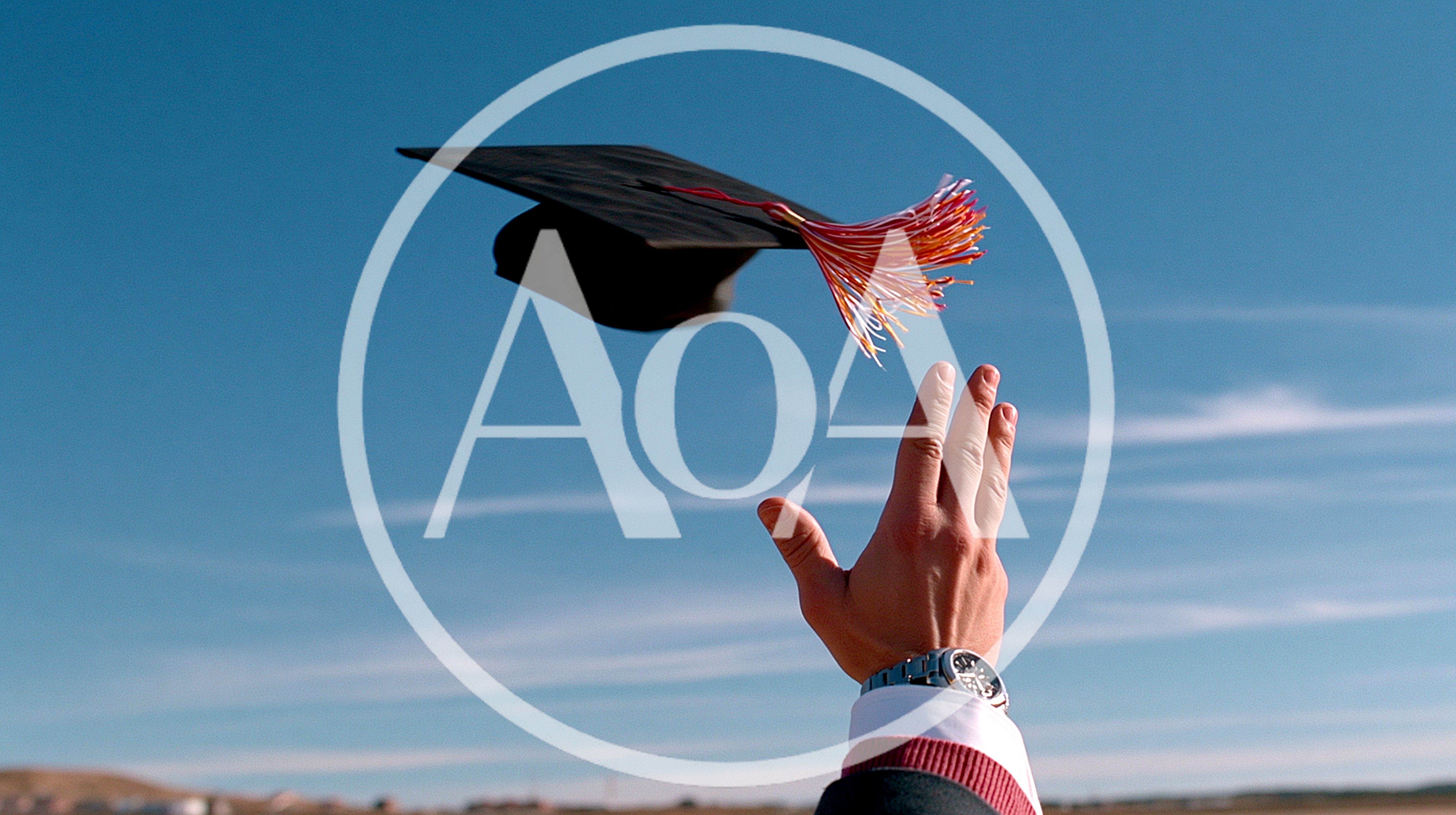 Graduate Throwing Academic Cap Into The Blue Sky