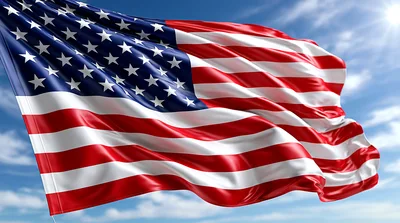 American Flag Waving Against A Bright Blue Sky