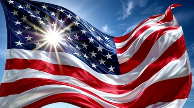 Waving American Flag Against A Bright Sunny Sky
