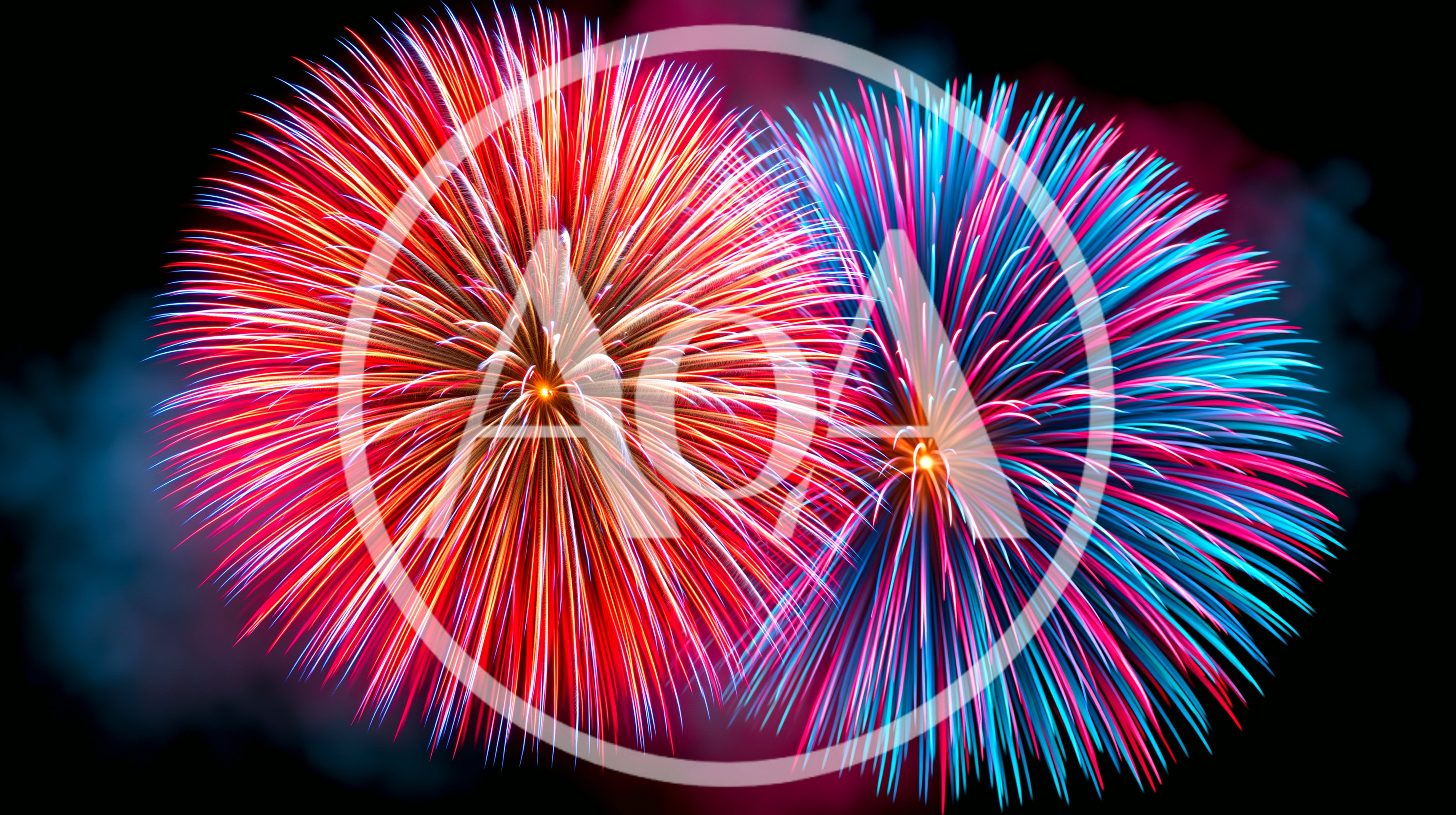 Vibrant Red And Blue Fireworks Bursting In Night Sky