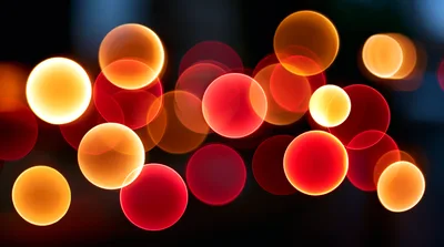 Abstract Bokeh Background With Glowing Red And Orange Orbs