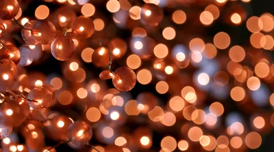 Abstract Background Of Glowing Warm Bokeh Lights