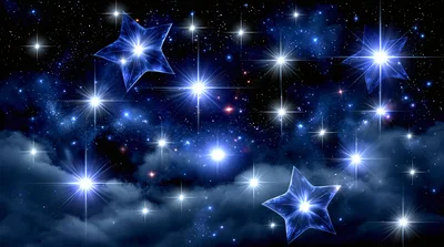 Glowing Blue Stars In A Night Sky With Clouds