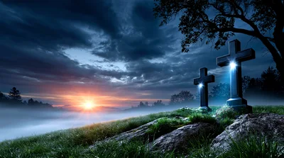 Two Stone Crosses on a Misty Hill at Sunrise
