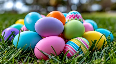 Colorful Easter Eggs Scattered In Green Grass