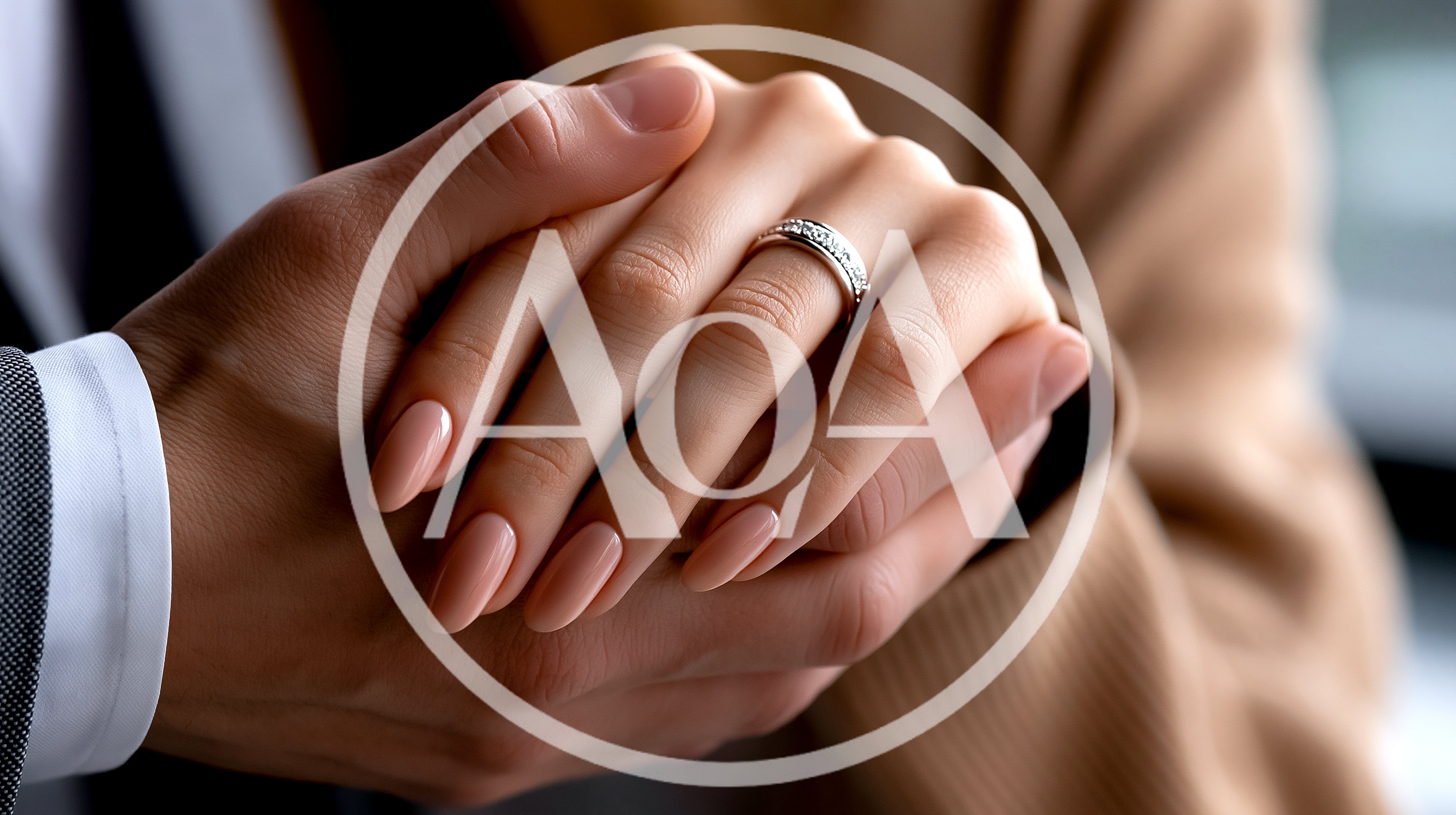Close Up Of A Couple Holding Hands With Wedding Ring