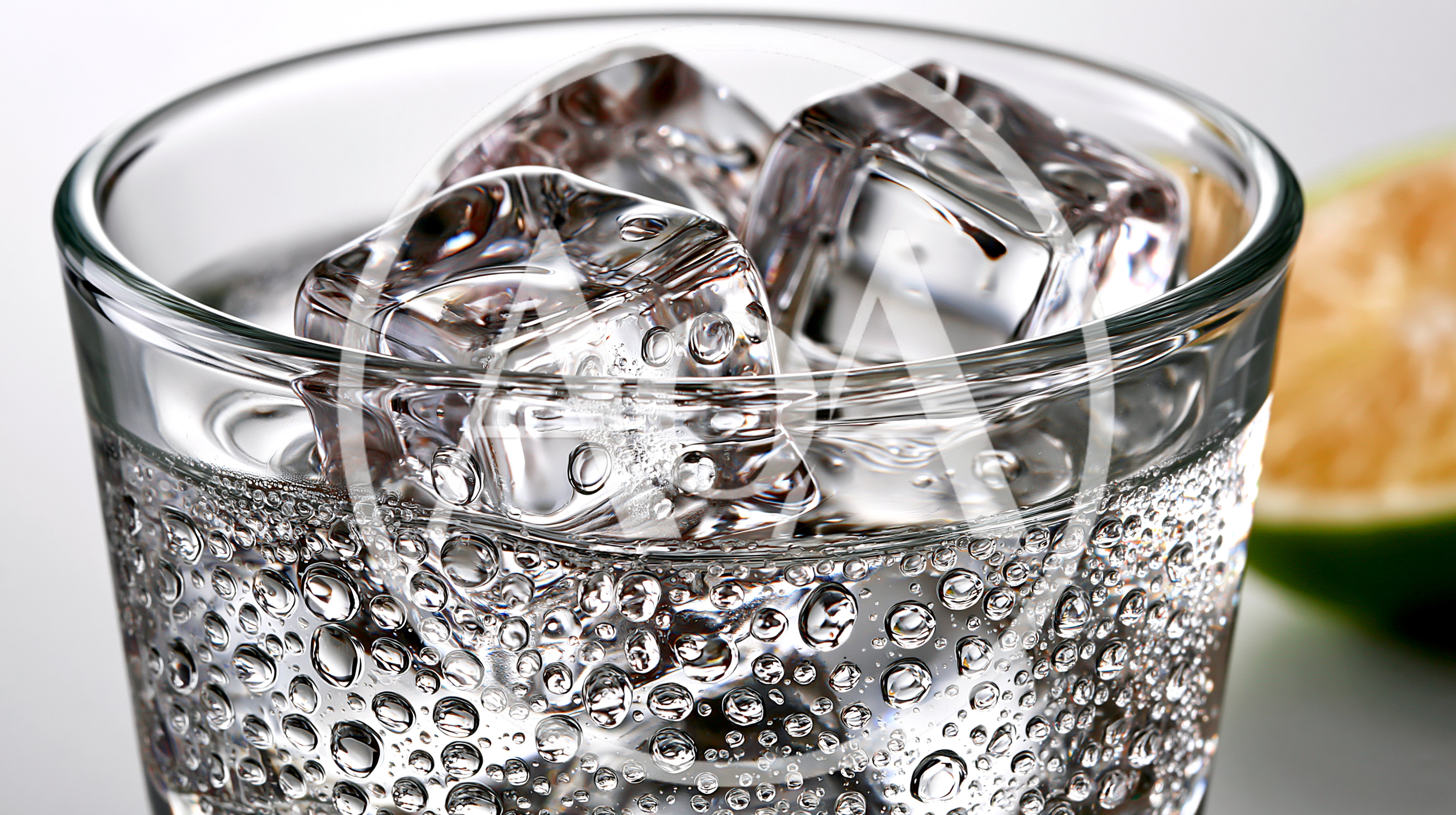 Glass Of Sparkling Water With Ice Cubes