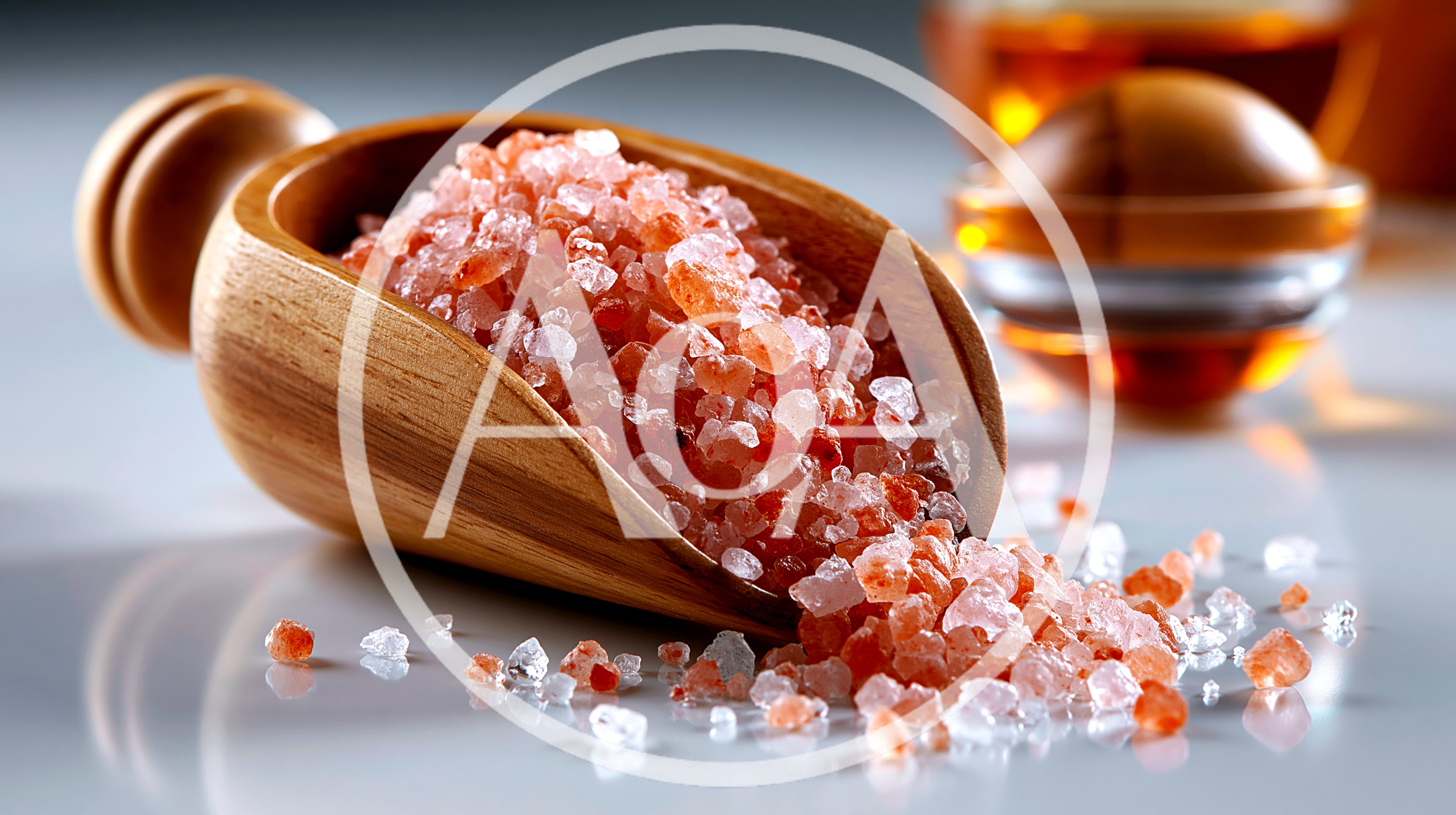 Himalayan Pink Salt Crystals In A Wooden Scoop