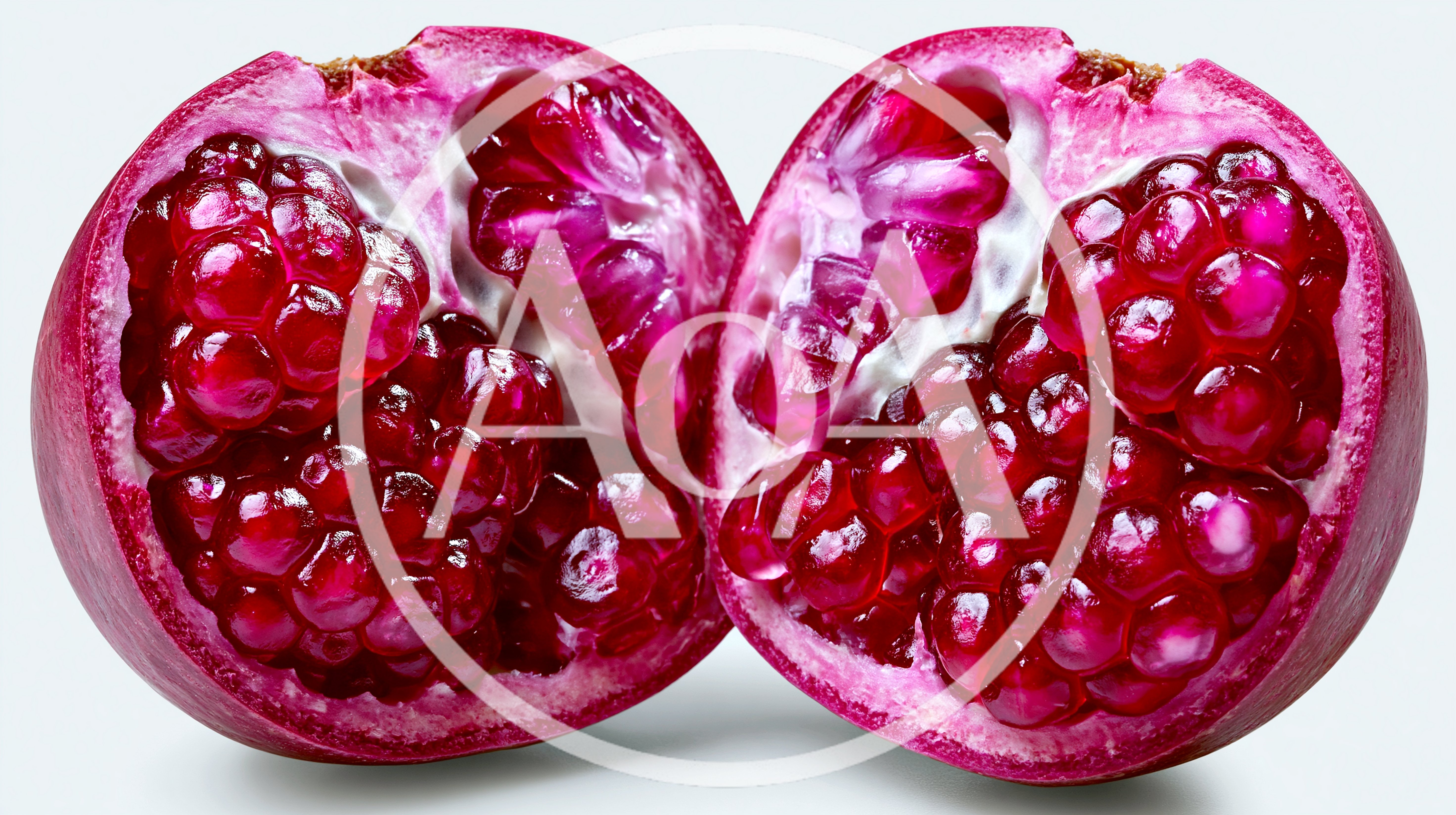 Two Halves Of A Fresh Ripe Pomegranate
