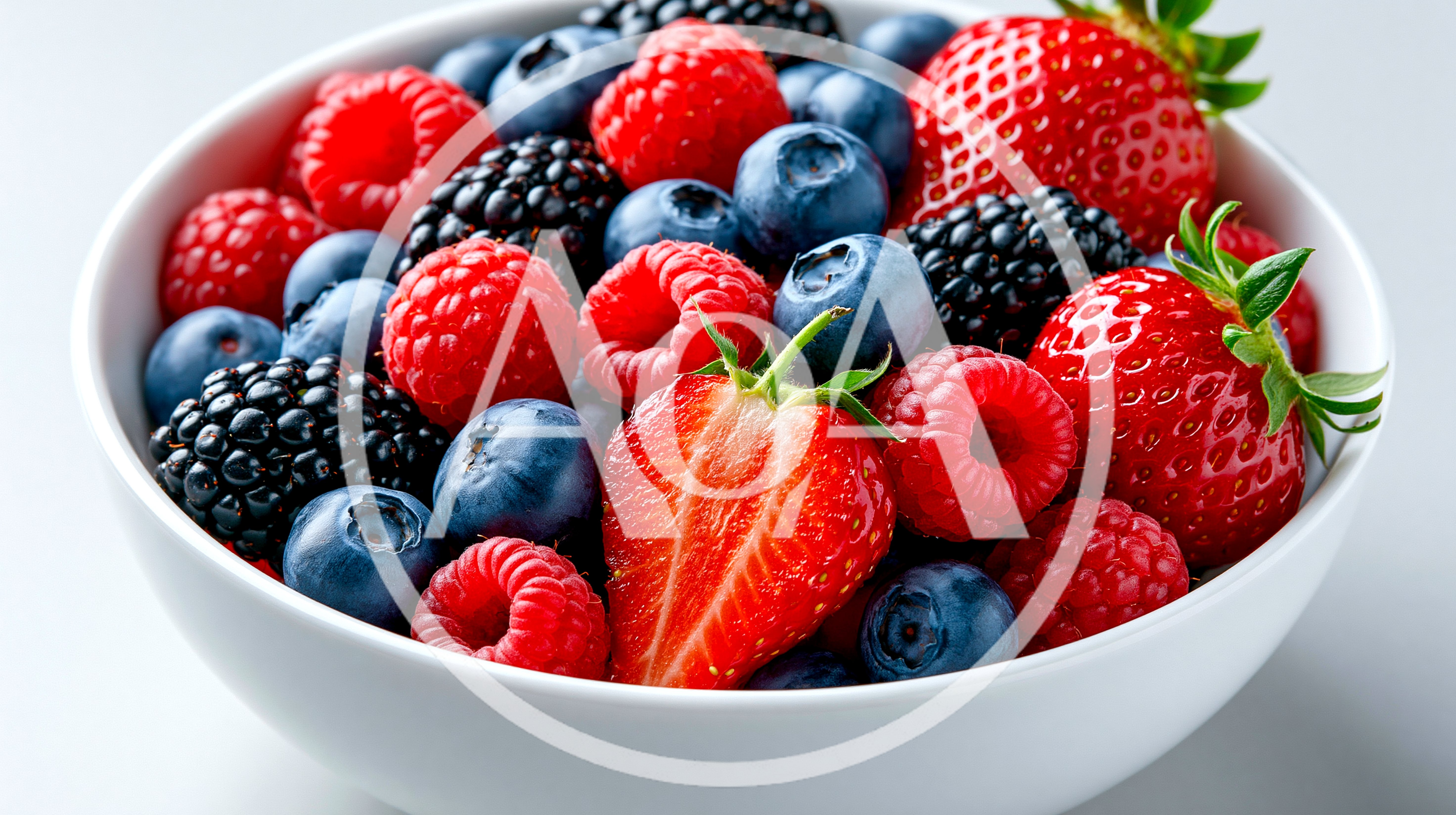 Fresh Mixed Berries In A White Bowl