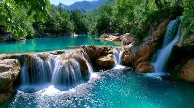 Cascading Waterfalls Into A Turquoise Mountain River