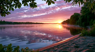 Serene Sunrise Over A Calm Riverbank