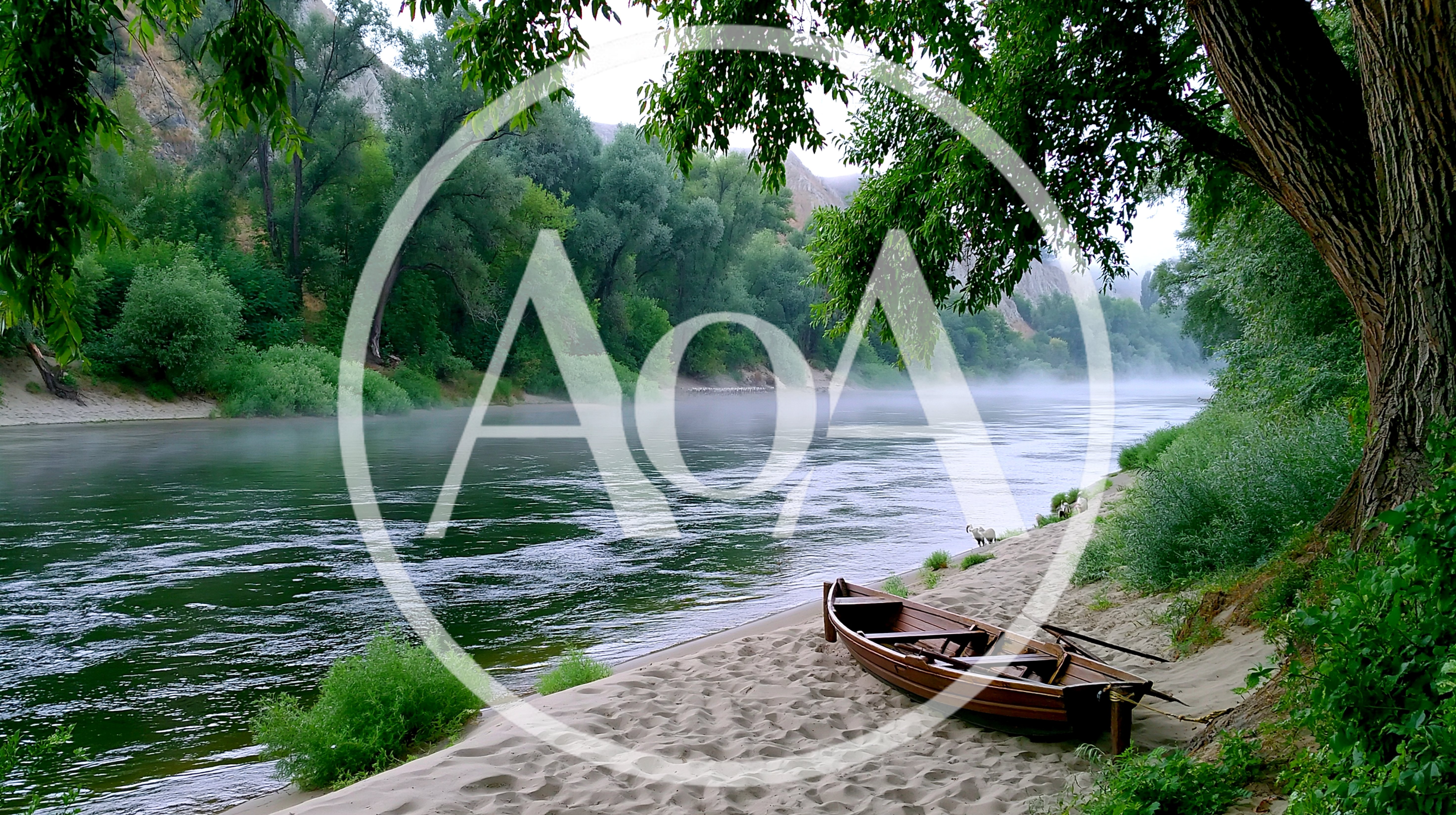 Wooden Rowboat Resting On A Misty Riverbank