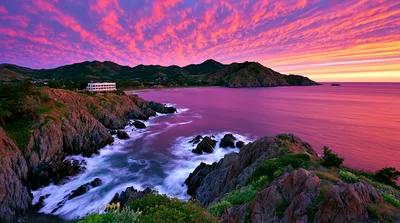 Stunning Sunset Over Rugged Coastal Cliffs And Ocean