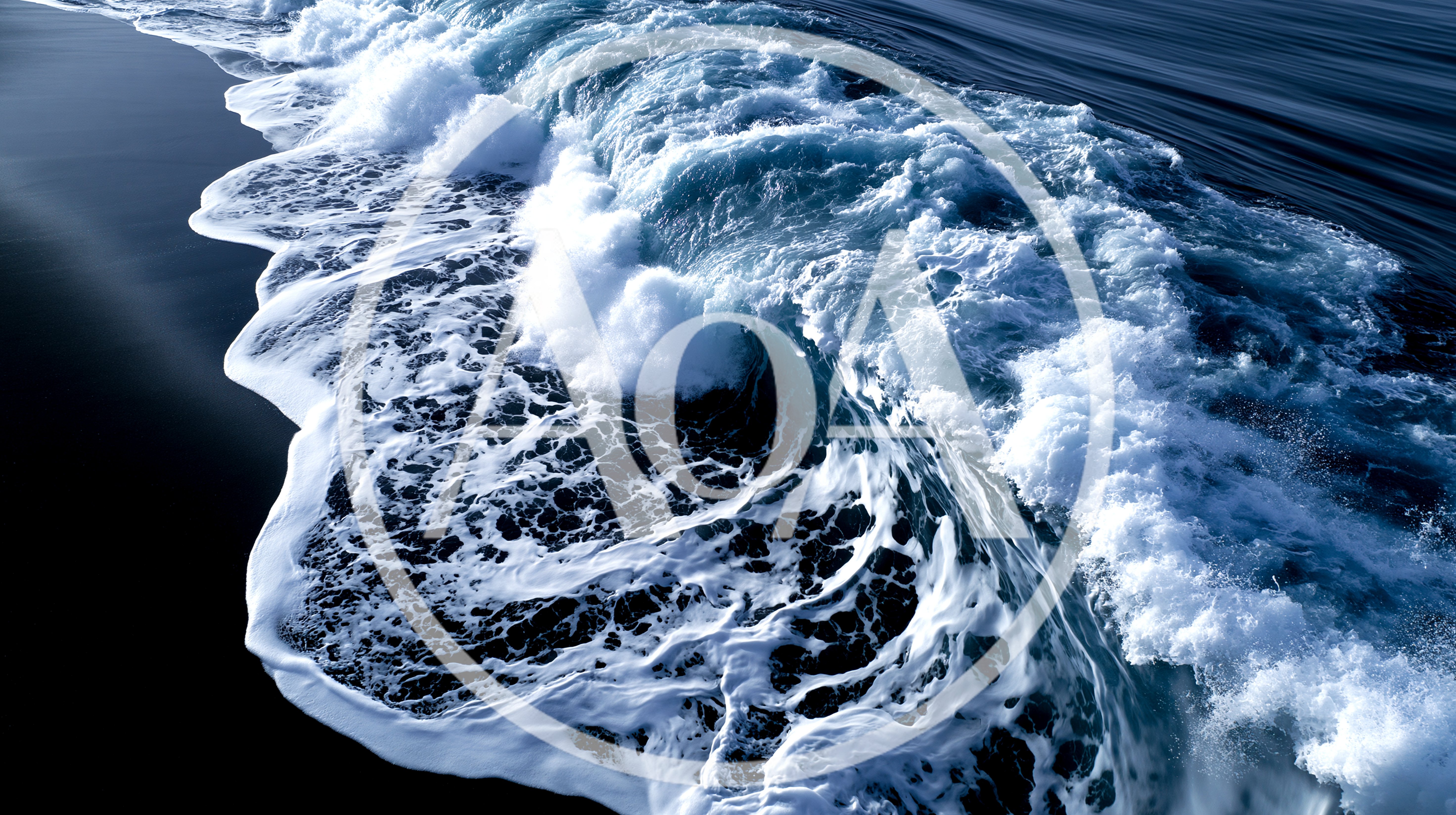 Aerial View Of Crashing Ocean Wave On Dark Sand