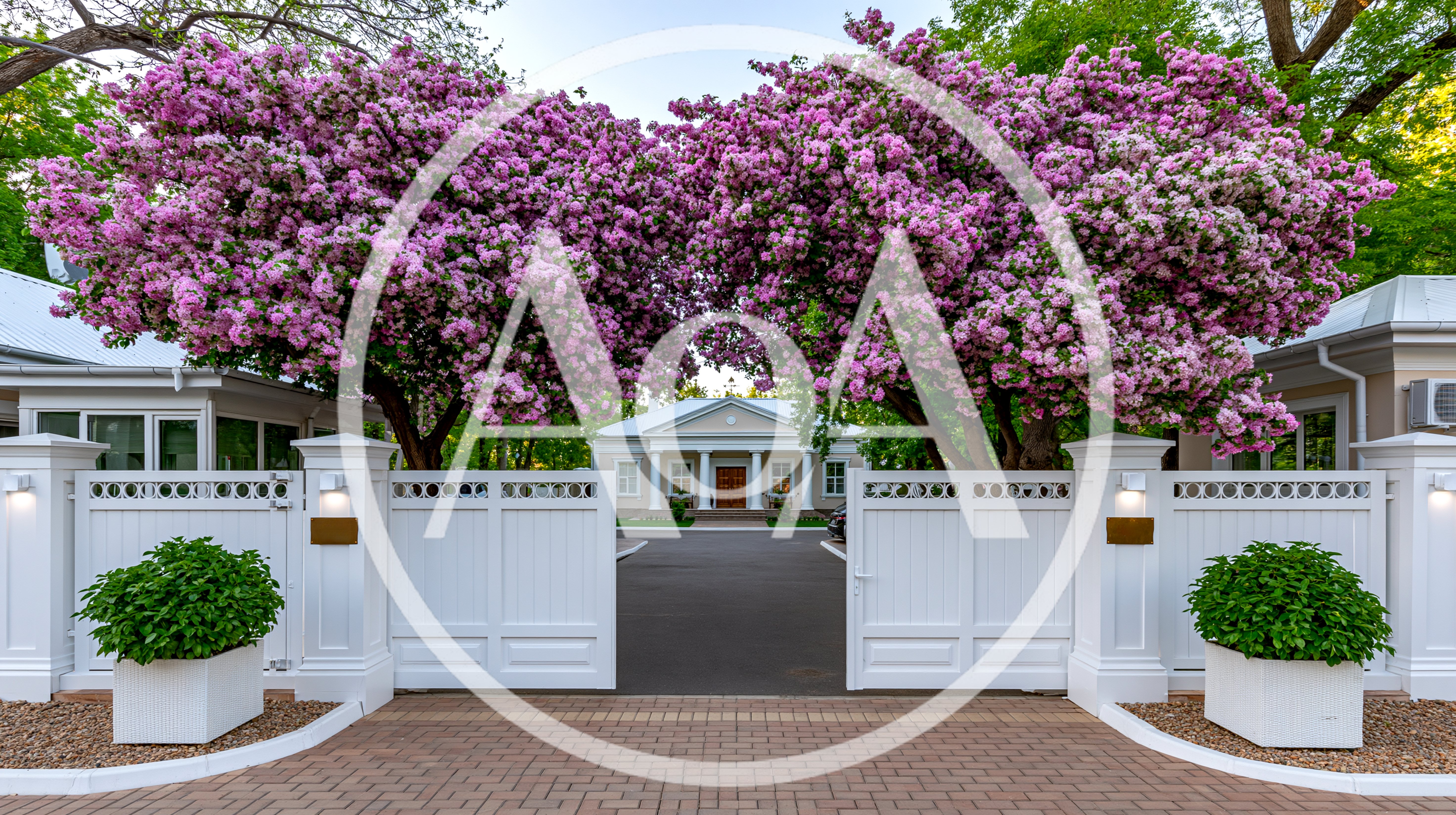 White Entrance Gates With Blooming Pink Trees