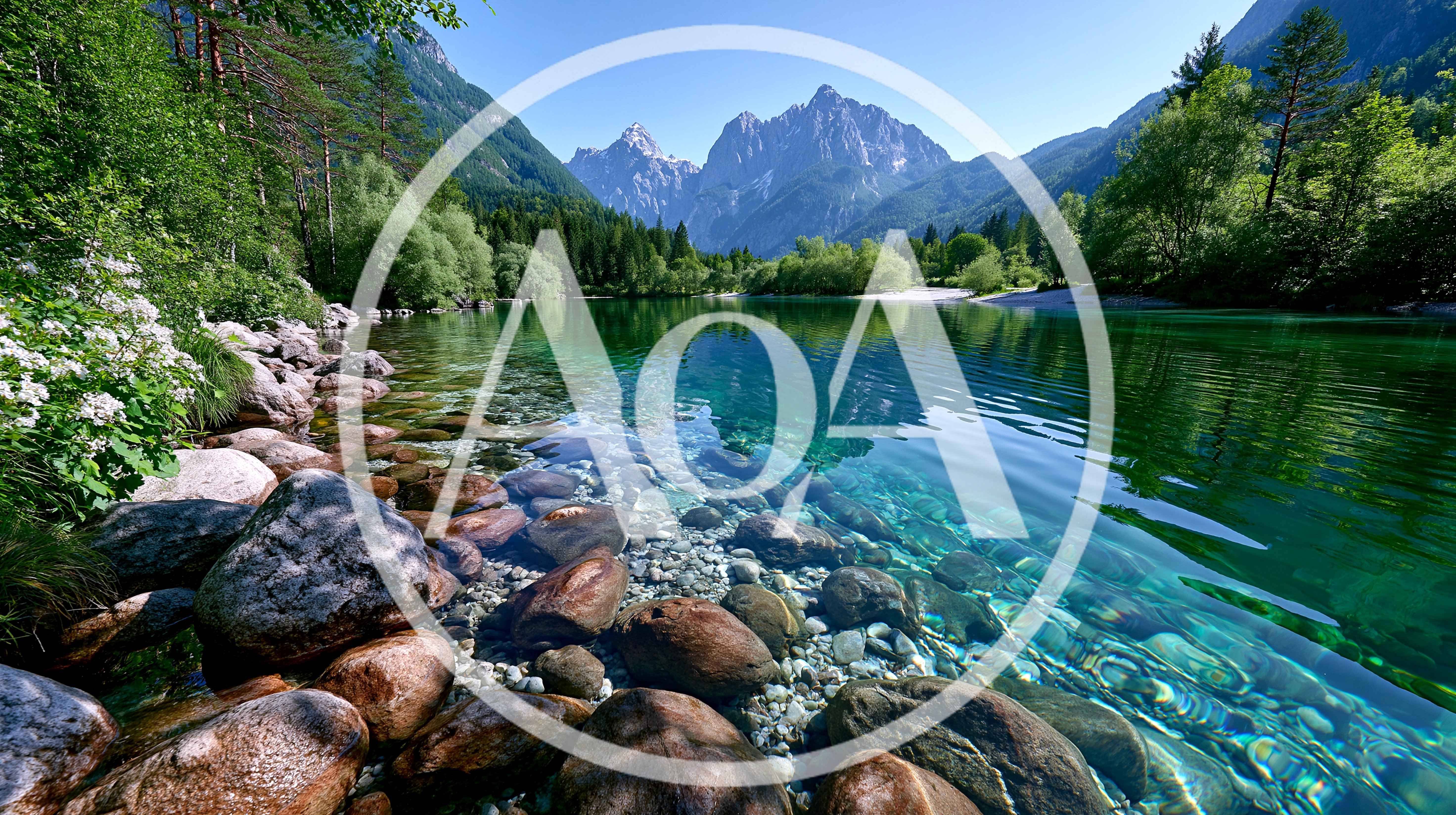 Crystal Clear Alpine River With Mountain Backdrop