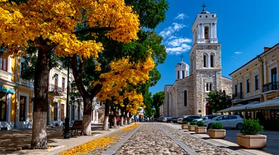 Cobblestone Street With Autumn Trees And Orthodox Church