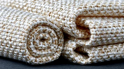 Close Up Of Rolled Natural Burlap Fabric