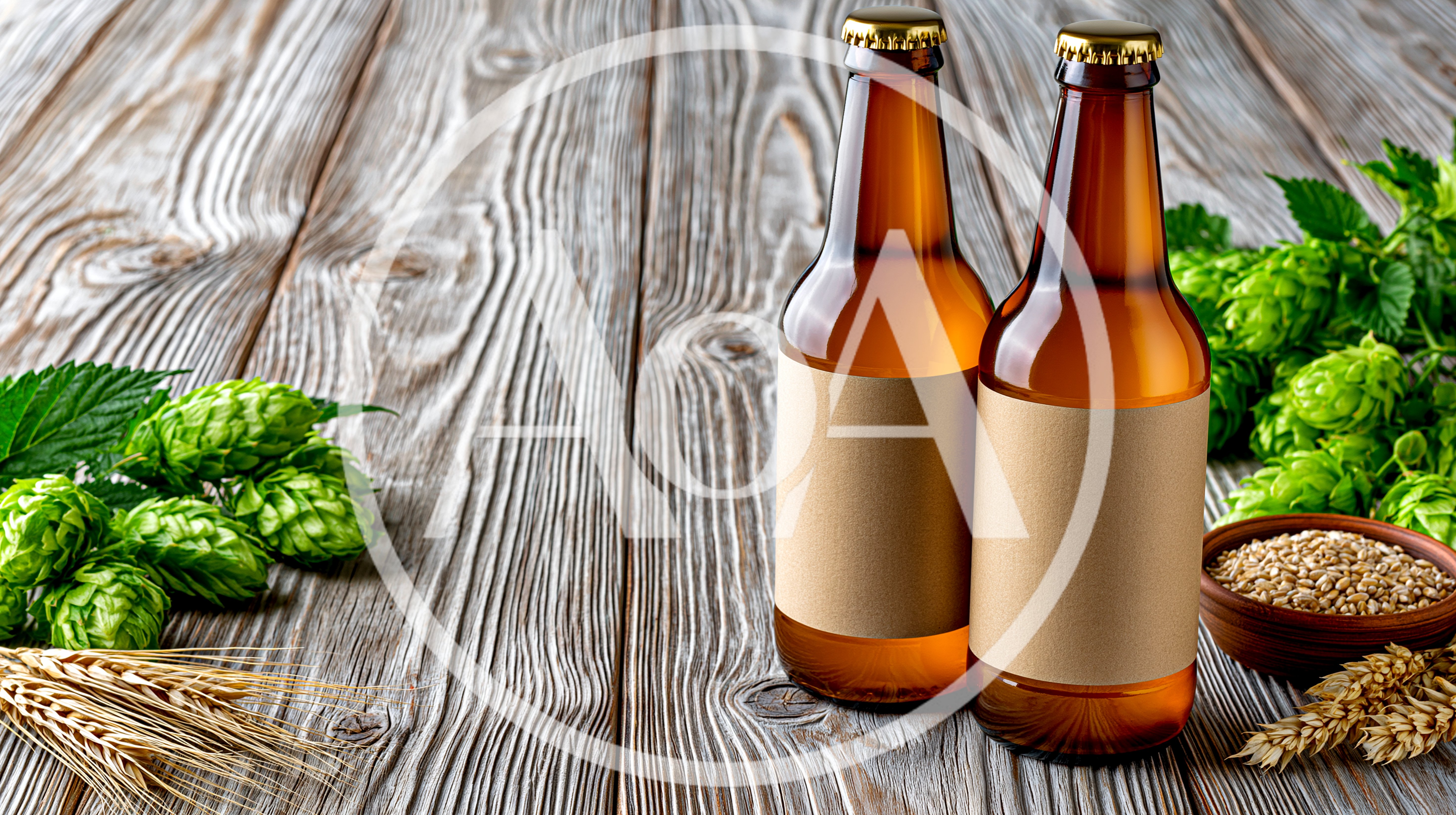 Two Amber Beer Bottles With Hops And Barley