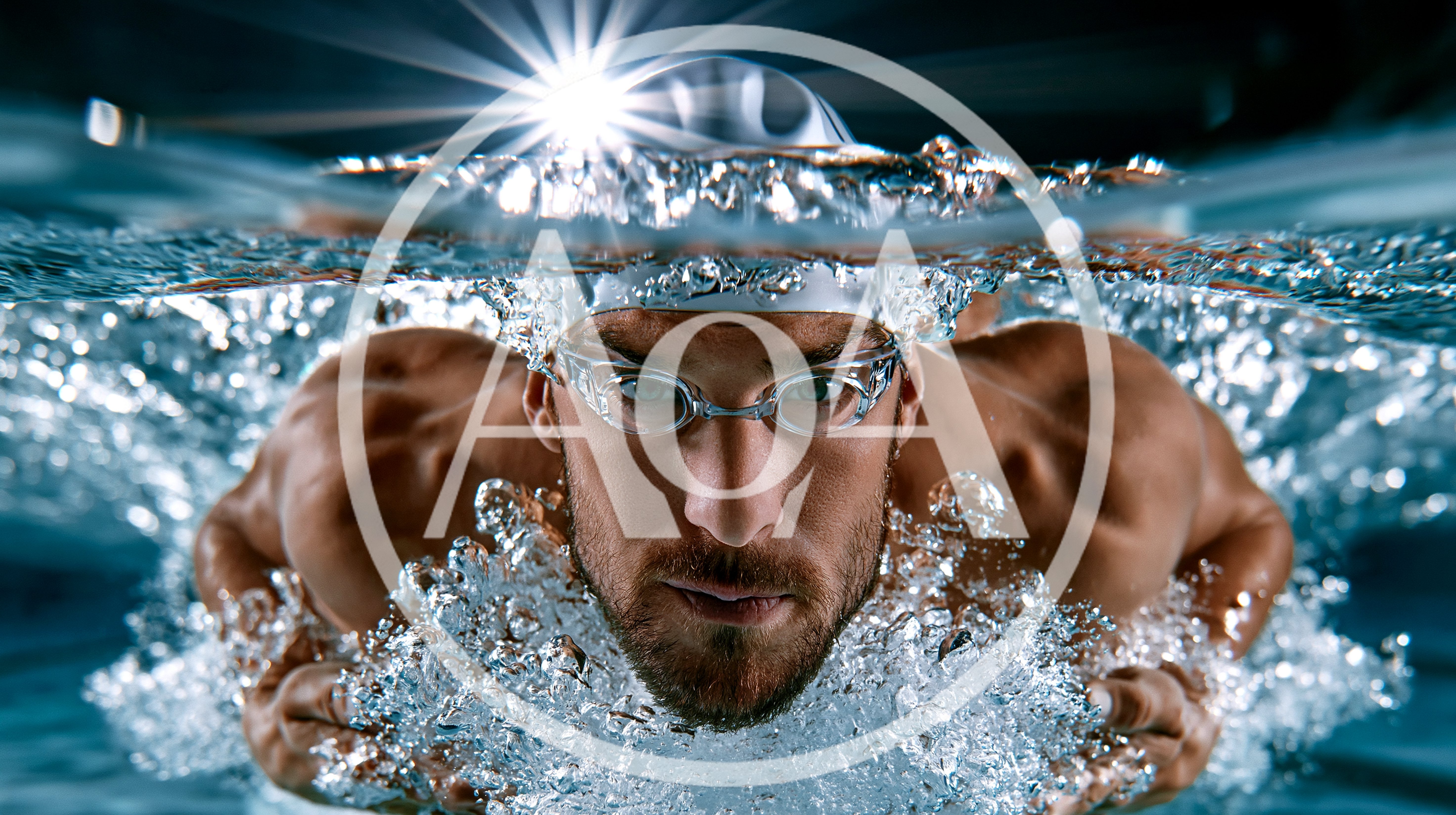 Professional Male Swimmer Emerging From Water Surface