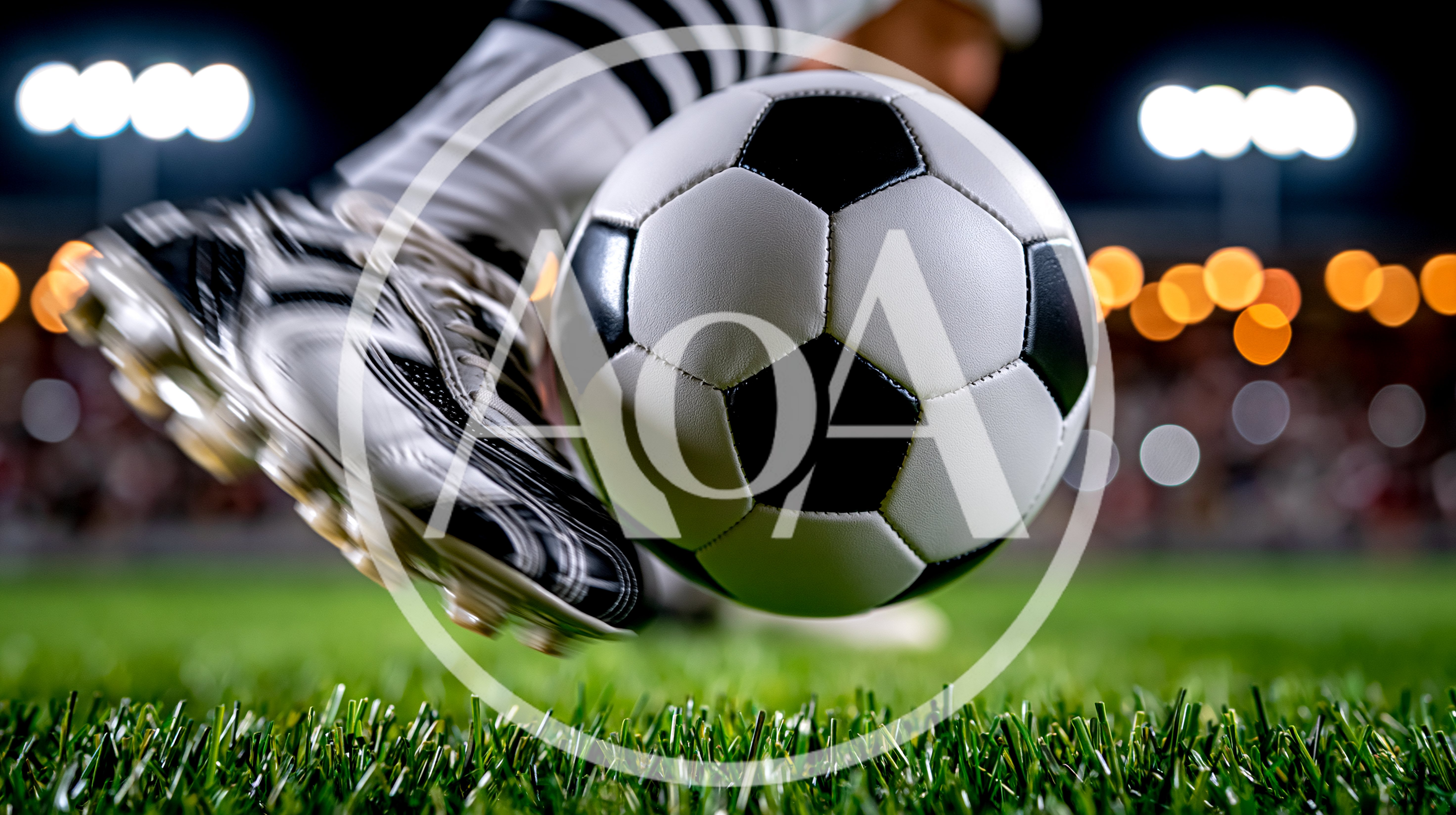 Soccer Player Kicking Ball On Grass Field