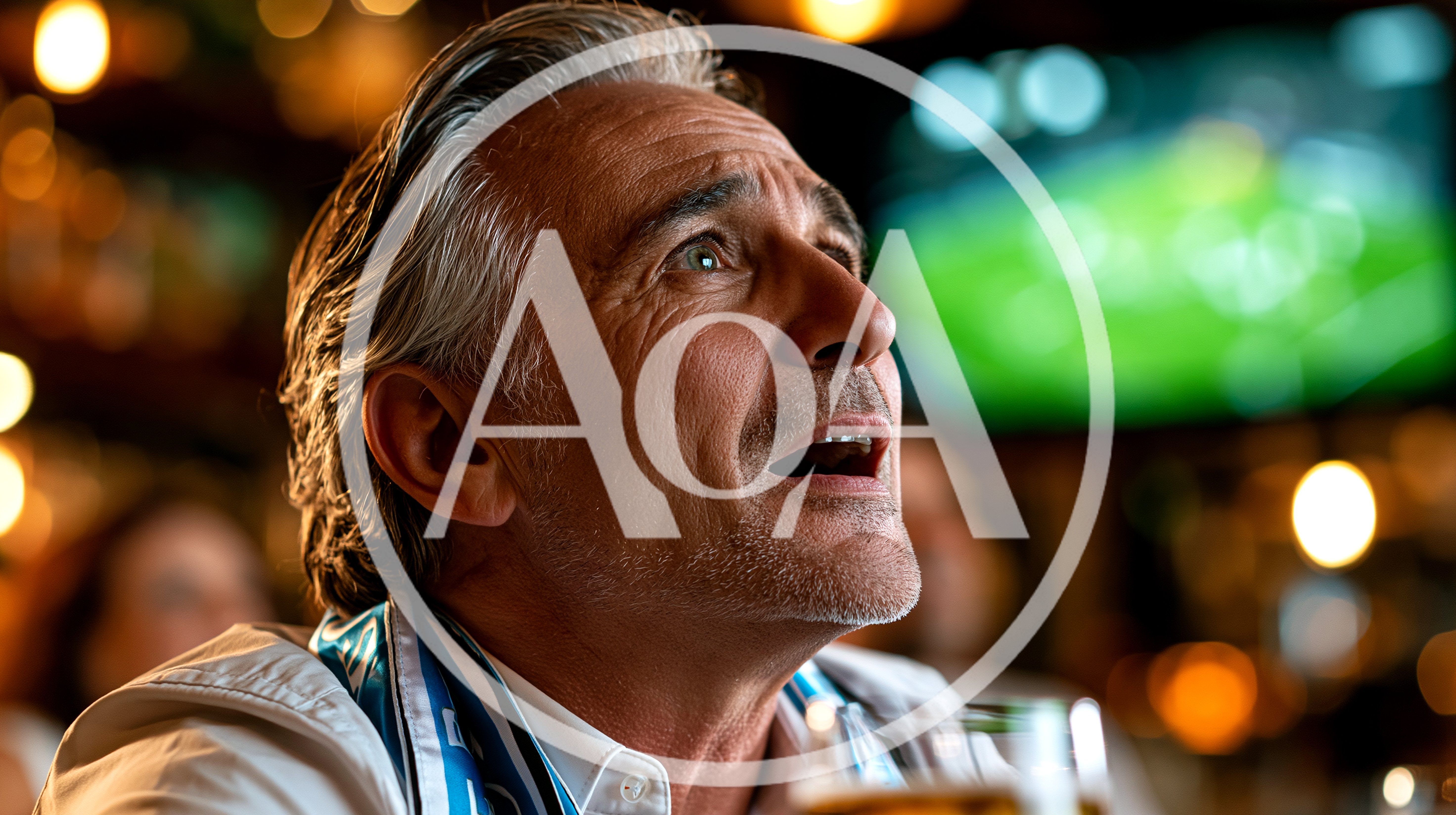 Middle Aged Man Watching Sports In A Bar