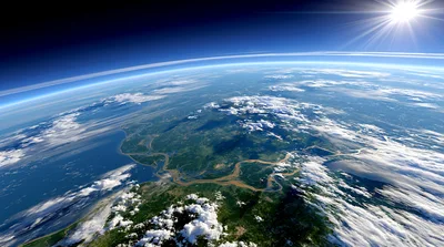 Aerial View Of Earth From Space With Sun Flare