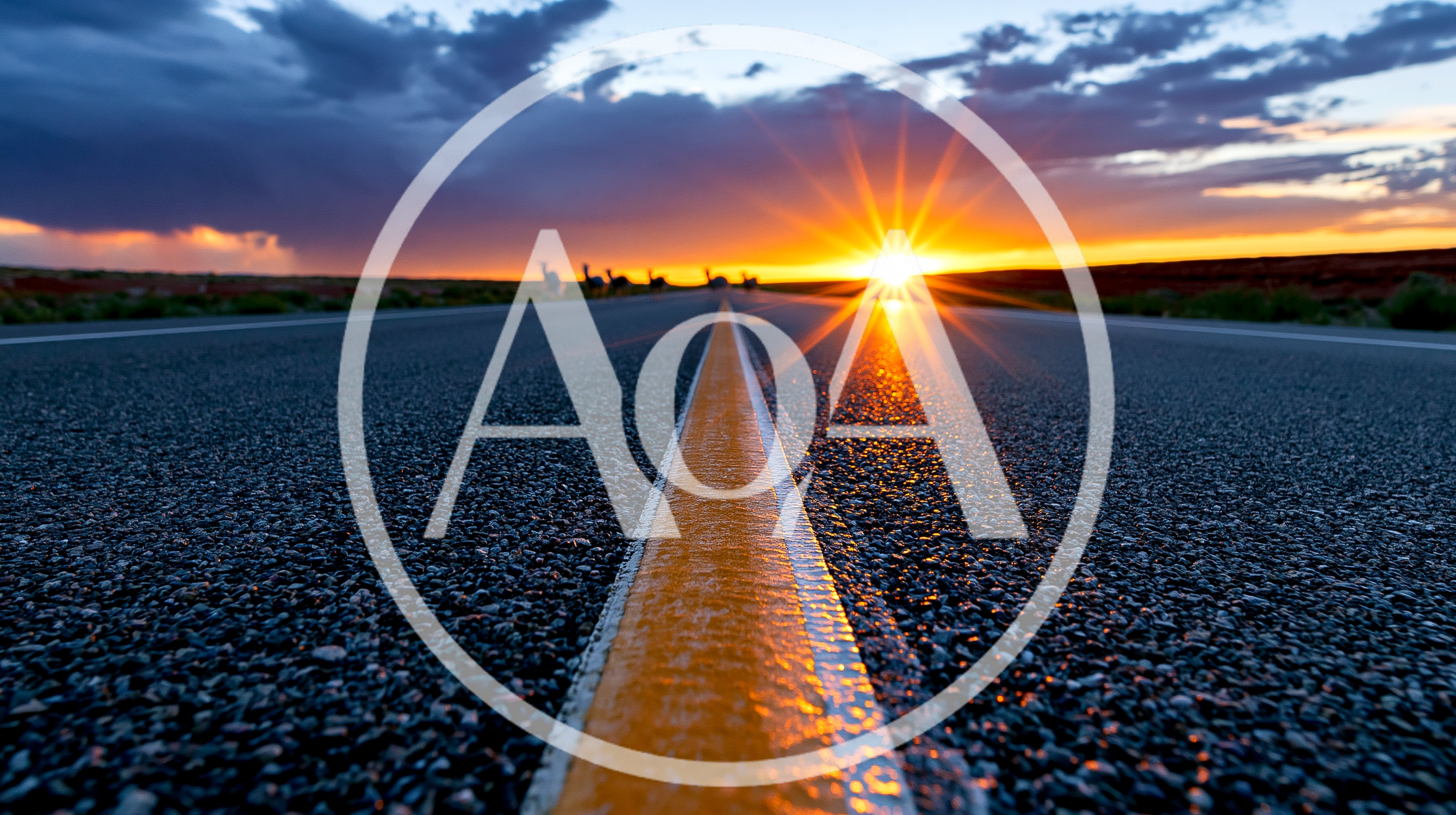 Empty Asphalt Road Leading Toward A Bright Sunset