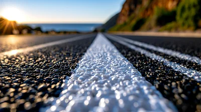 Low Angle View Of Asphalt Road With White Markings