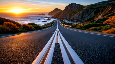 Coastal Highway Road Leading Toward Sunset Ocean Horizon