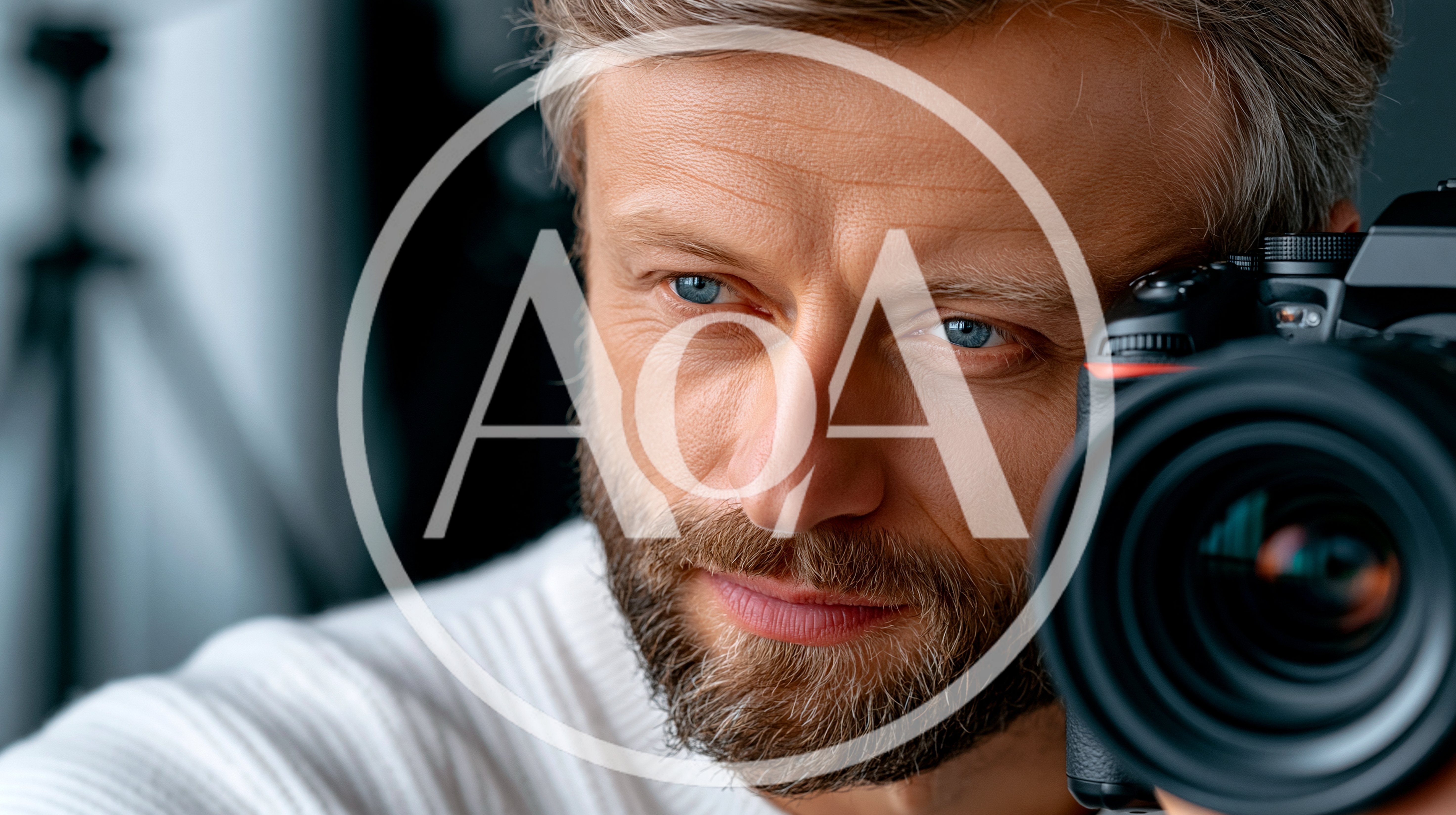 Professional Photographer Holding Camera In Studio