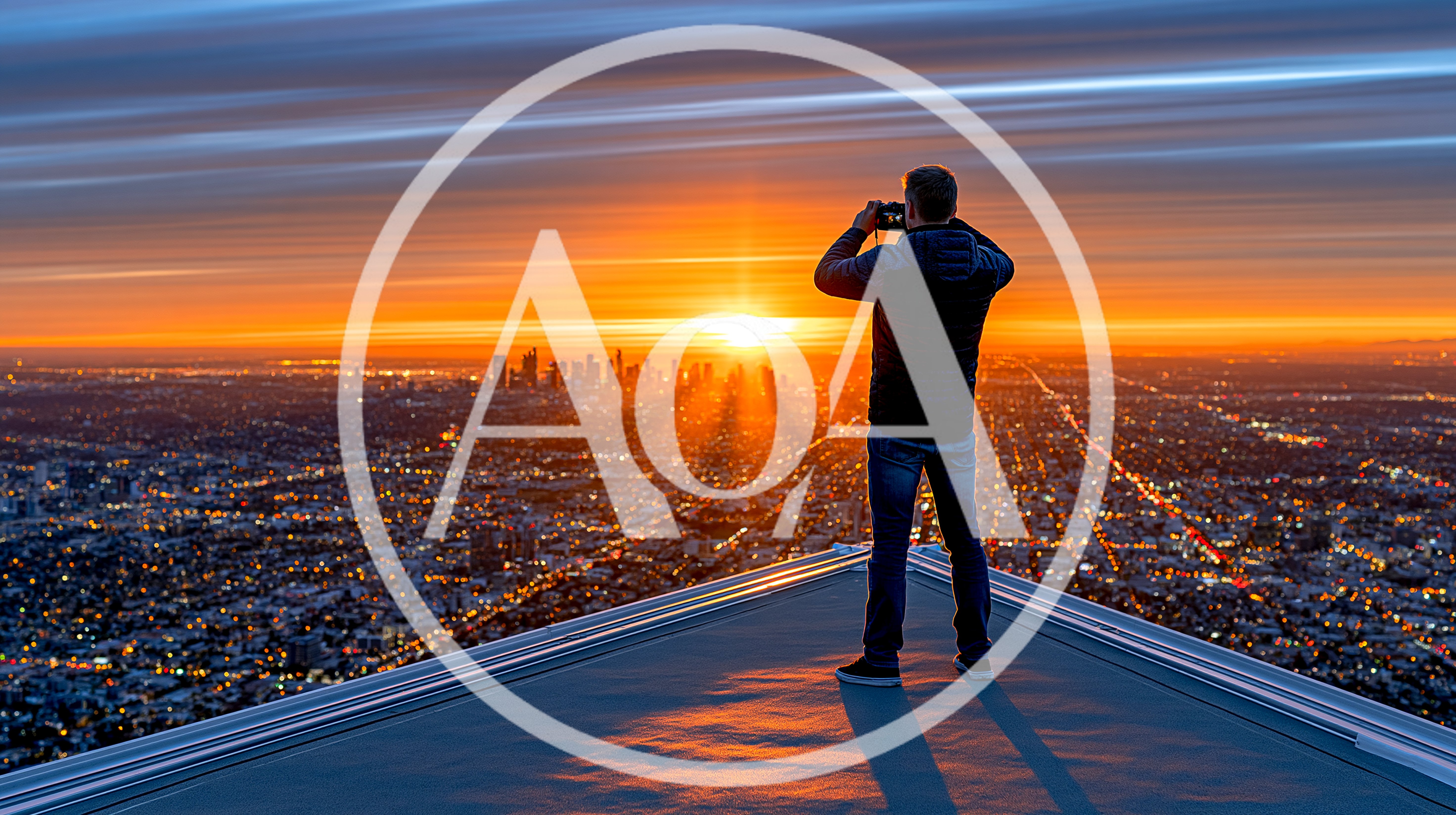 Photographer Standing On Rooftop Overlooking City At Sunset