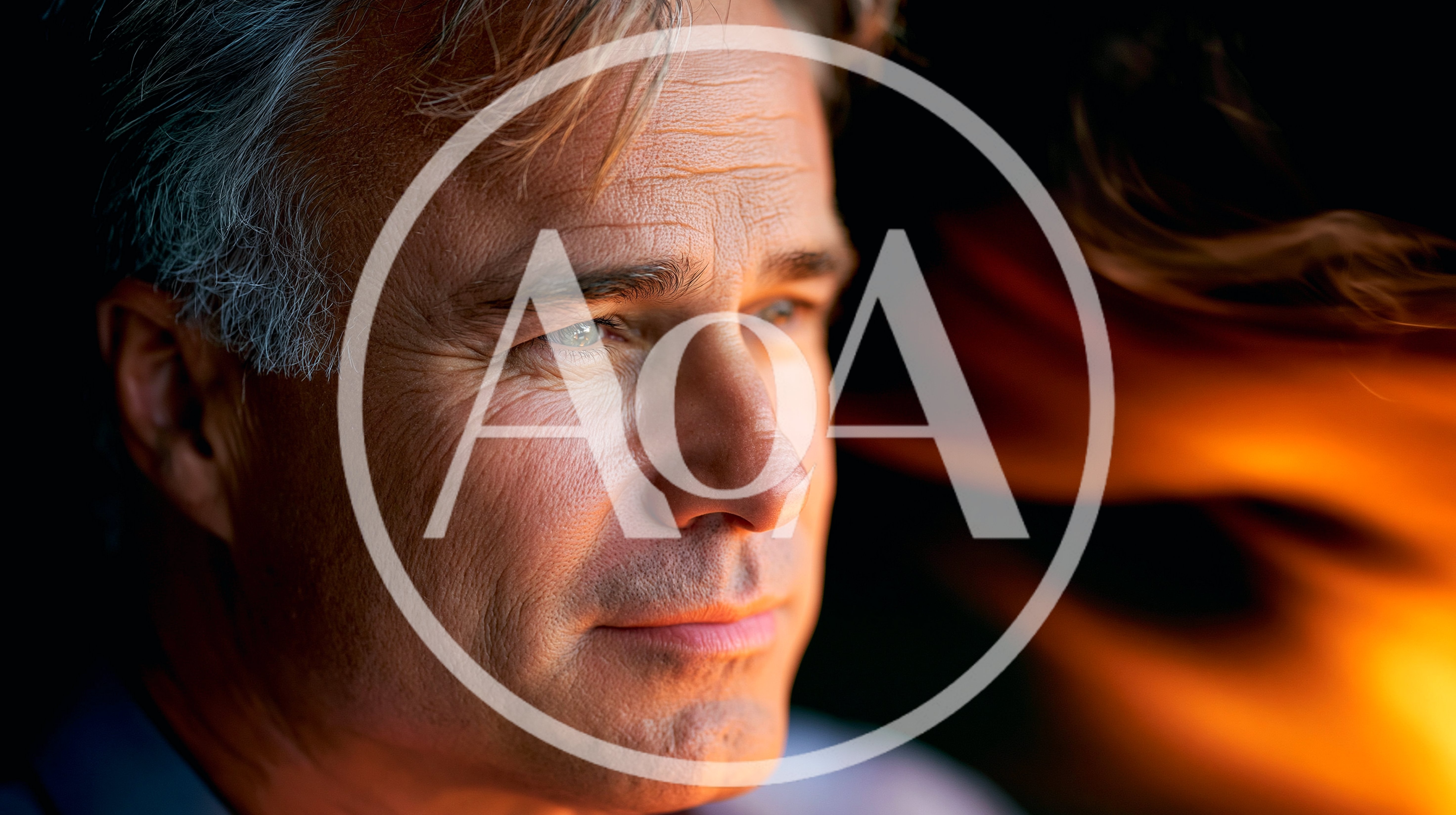 Thoughtful Mature Man Looking Away Near Firelight