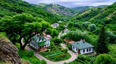 Picturesque Village Houses Nestled In A Lush Green Valley