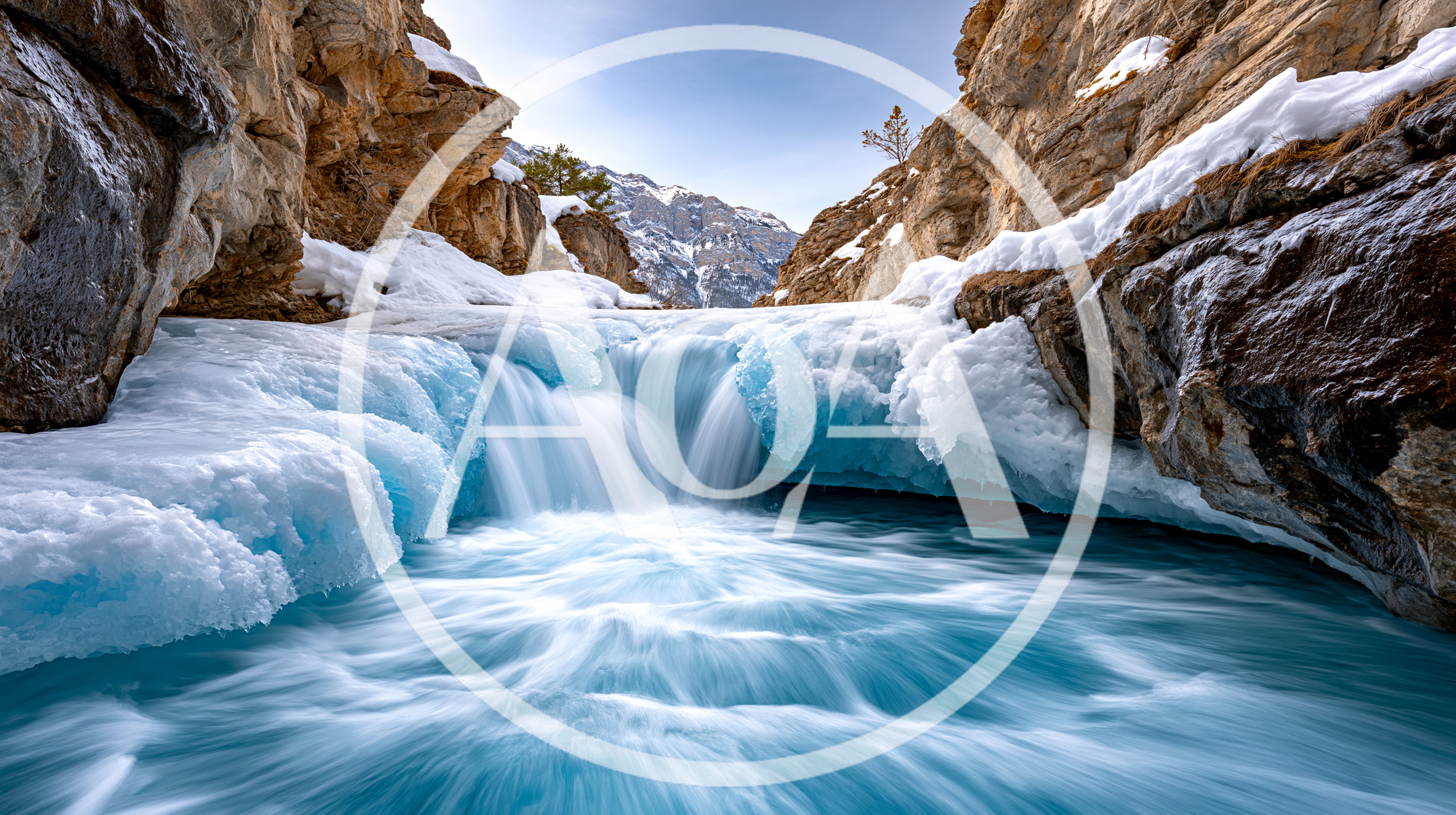 Frozen Waterfall Flowing Through Snowy Mountain Canyon