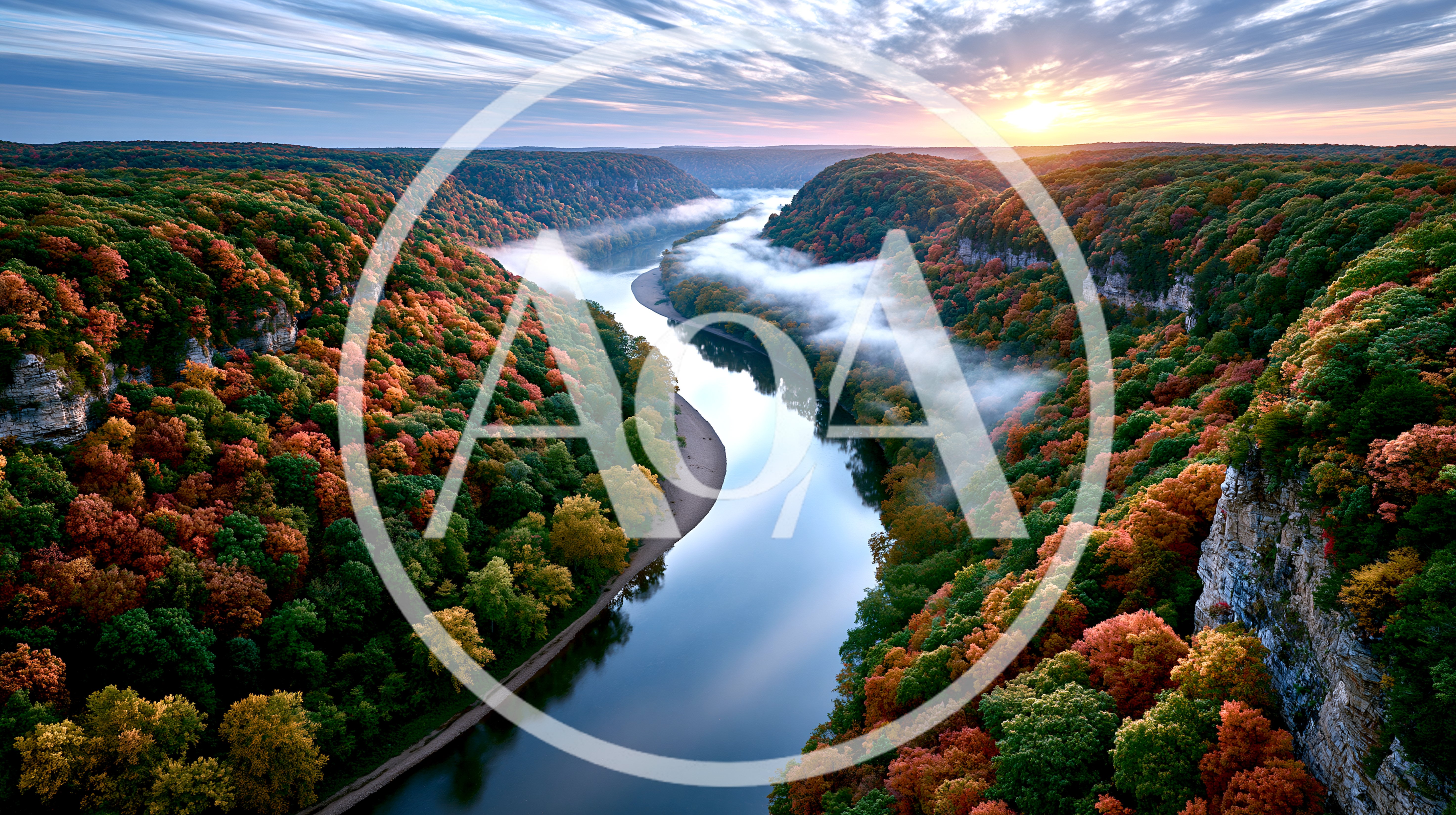 Aerial View Of A Winding River Through Autumn Forest