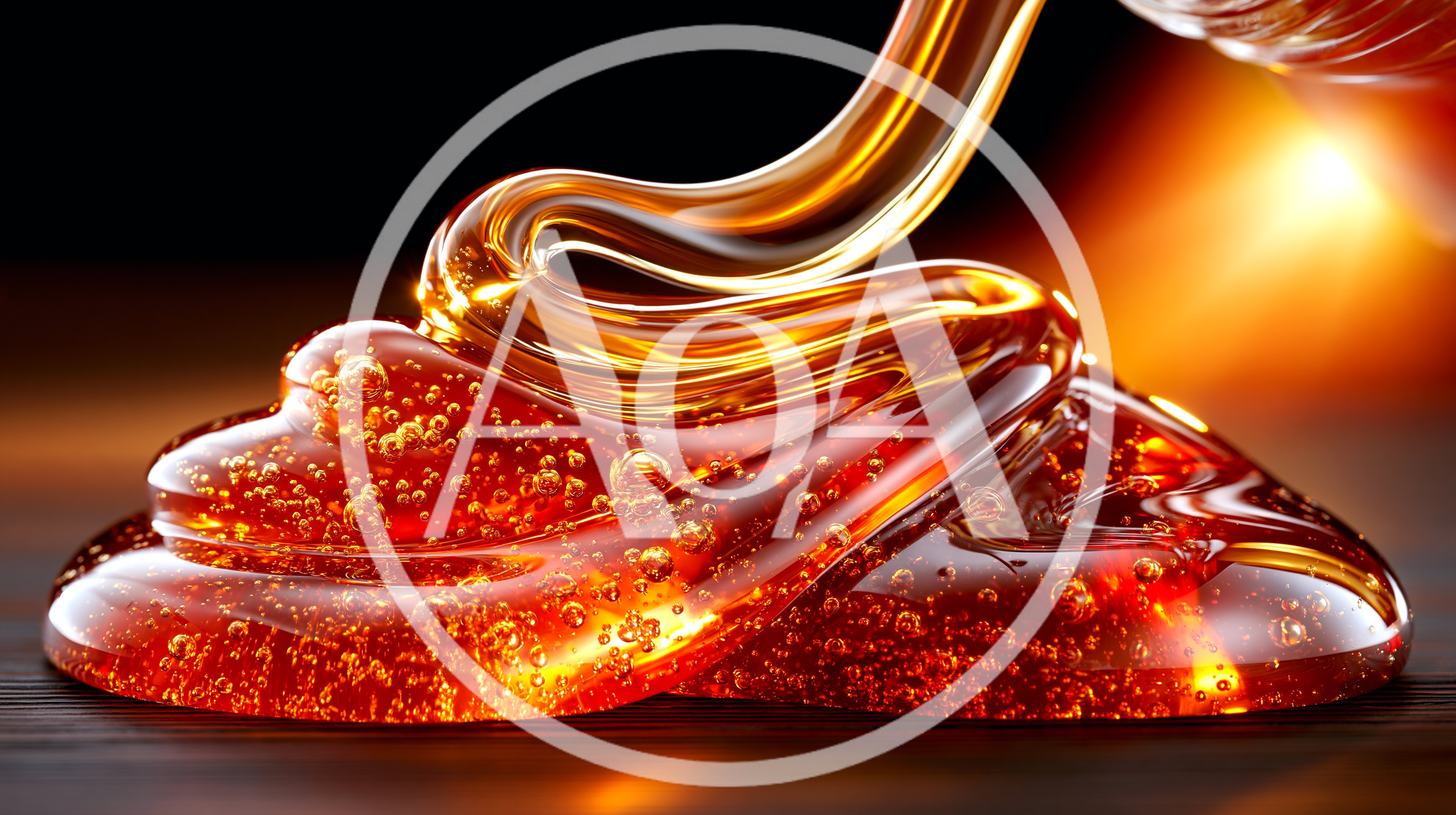 Golden Honey Pouring Onto A Dark Surface